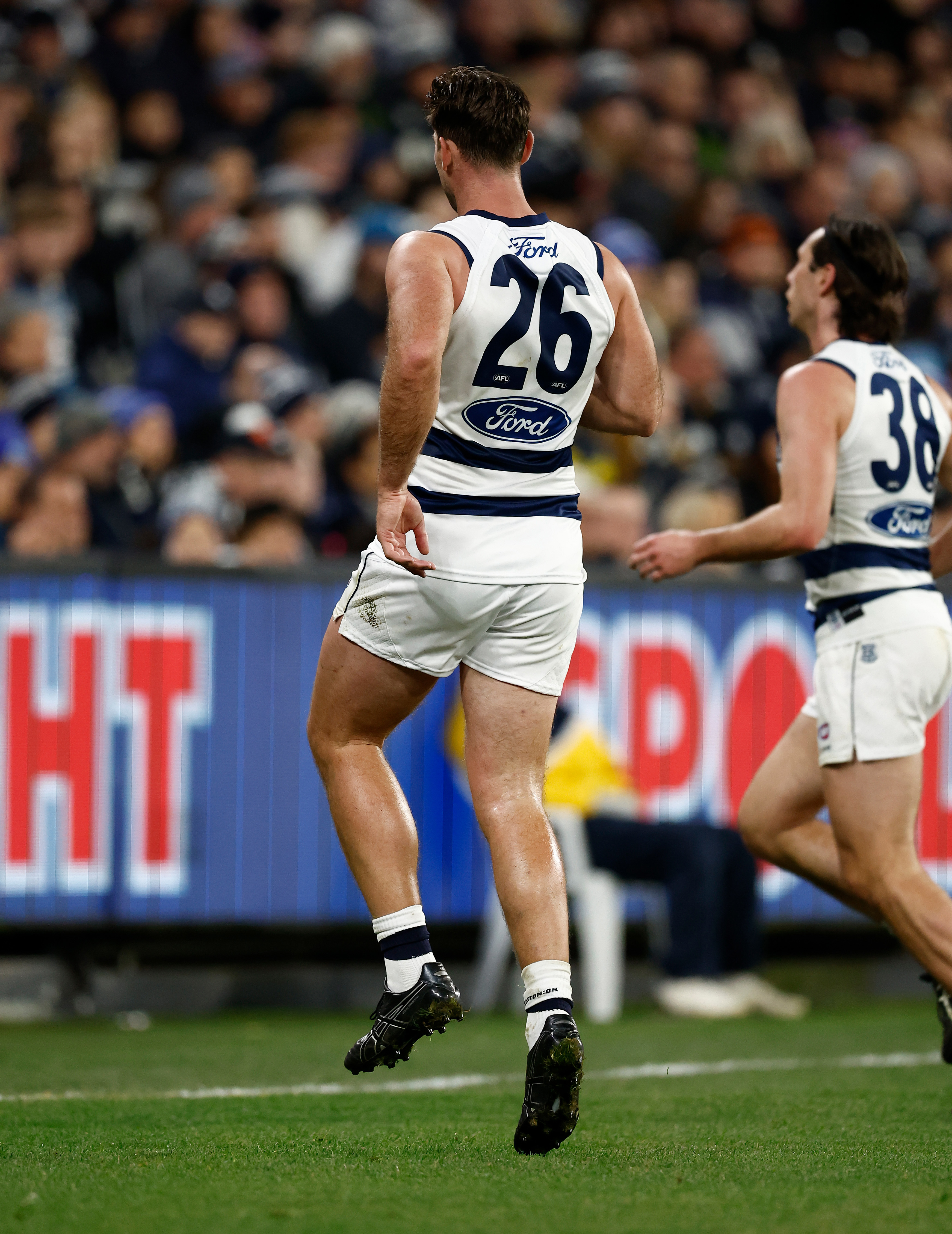 Tom Hawkins was forced off the ground at the MCG after injuring his ankle.