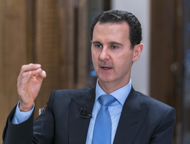 Syrian President Bashar Assad speaks during an interview with Iran's Al Alam TV, in Damascus, Syria
