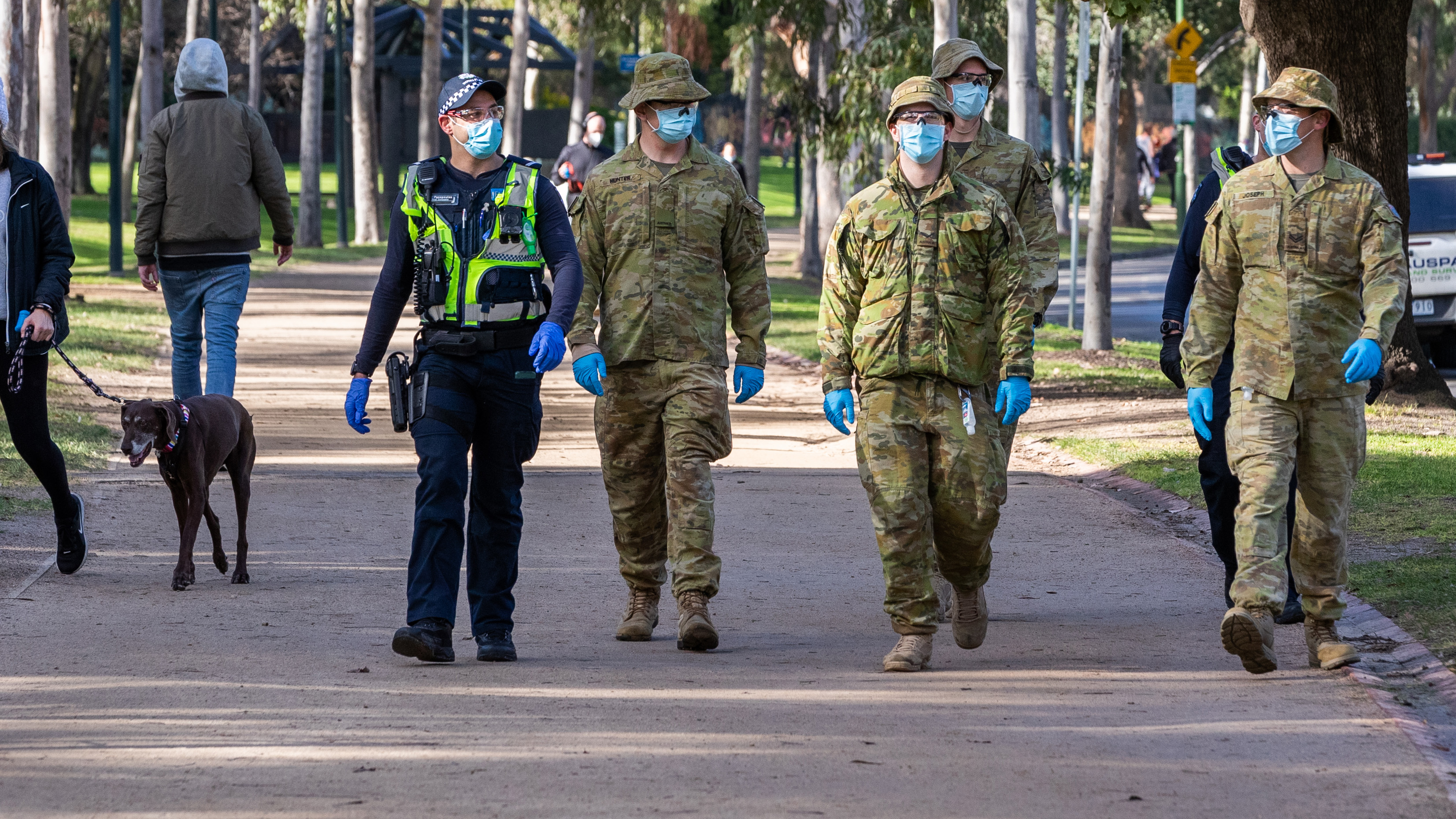 Australian Defense Force (ADF) personnel and Protective service officers are seen on patrol at the Tan running track on August 06, 2020 in Melbourne, Australia.  