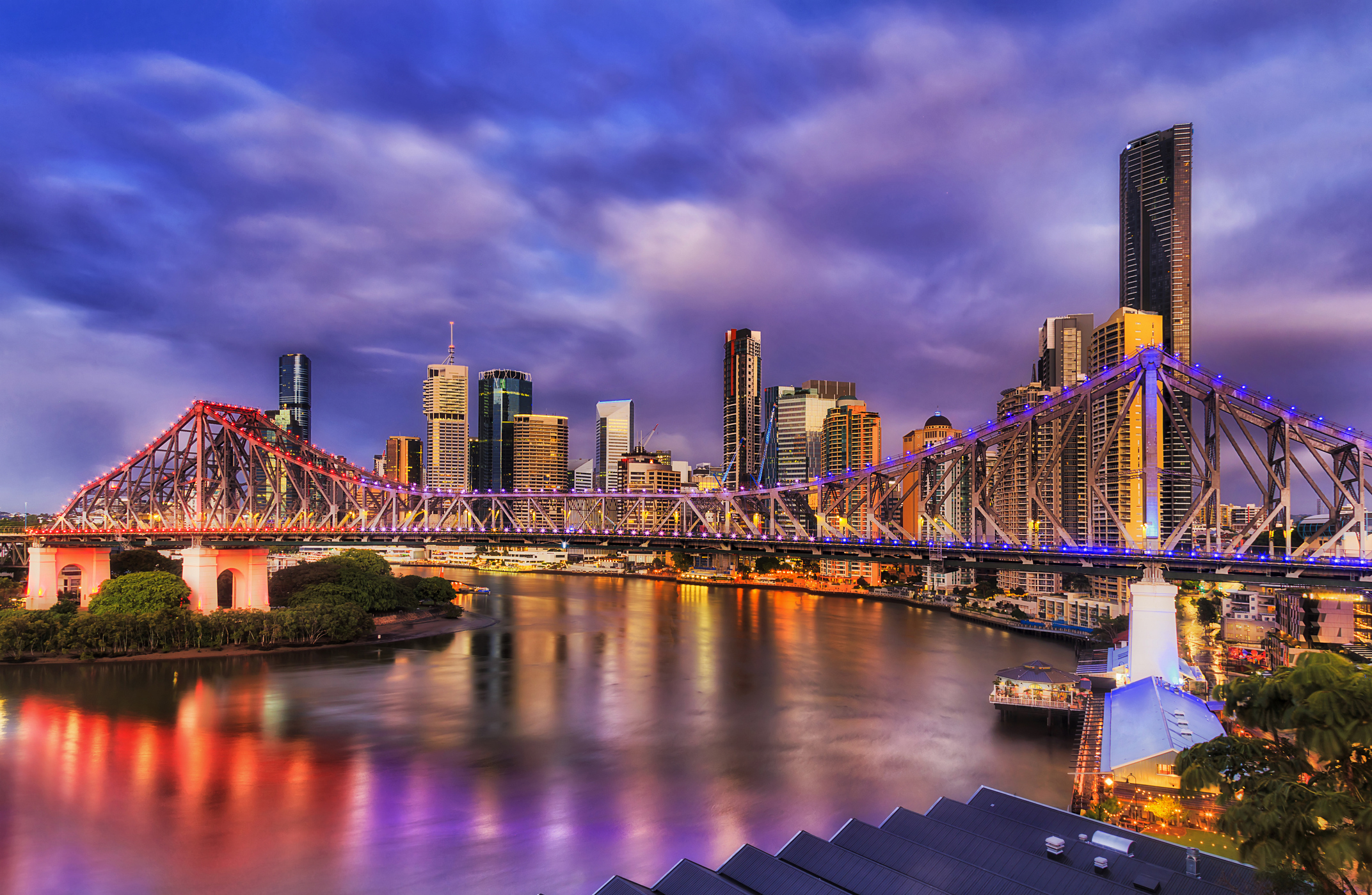 Story bridge across Brisbane river in Brisbane city CBD at sunrise.