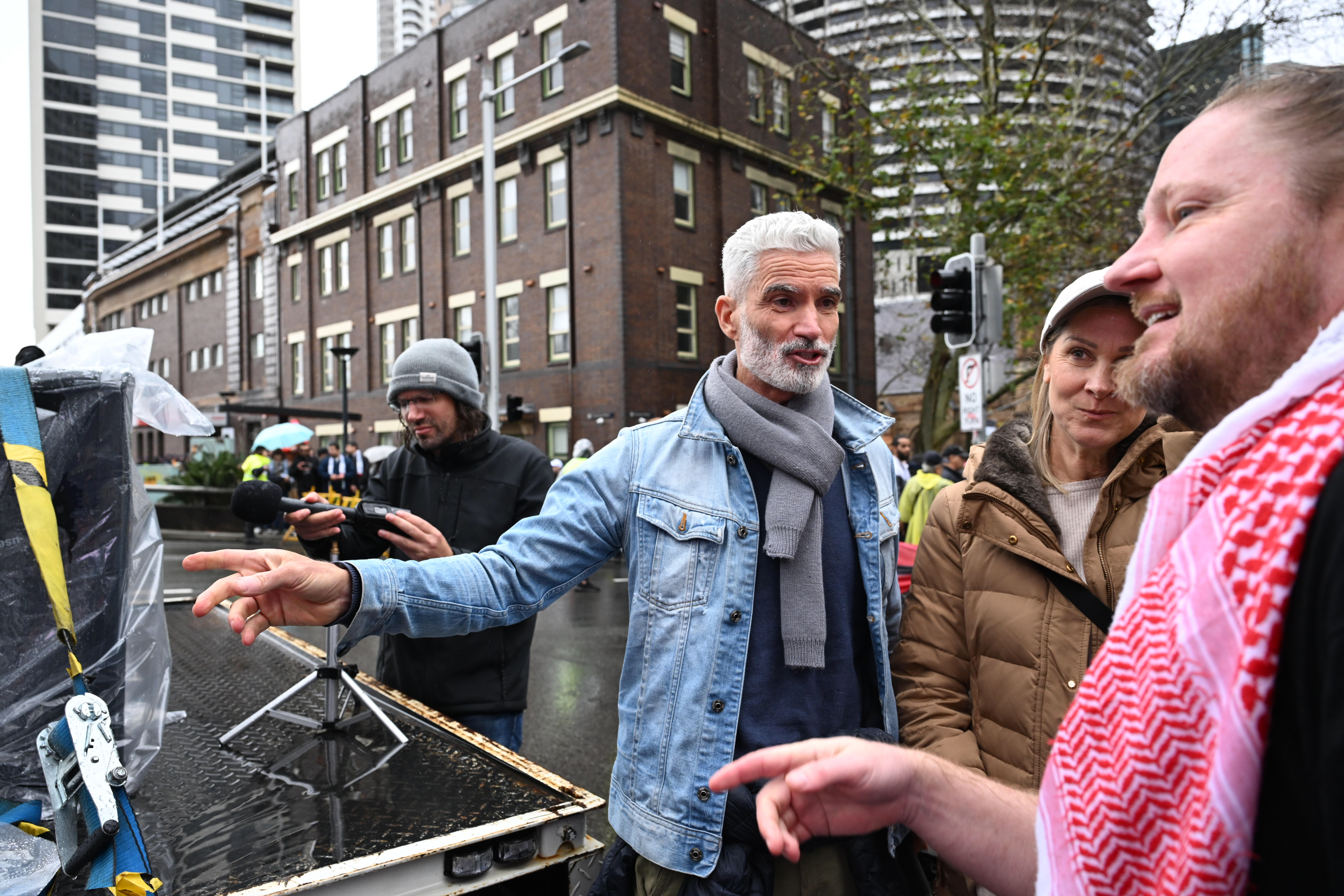 Craig Foster and Josh Lees with Pro-Palestine protesters gather before marching across the Sydney Harbour Bridge to bring attention to the ongoing Israel bombing and aid restrictions to Gaza. 3 August 2025 Photo: Janie Barrett 