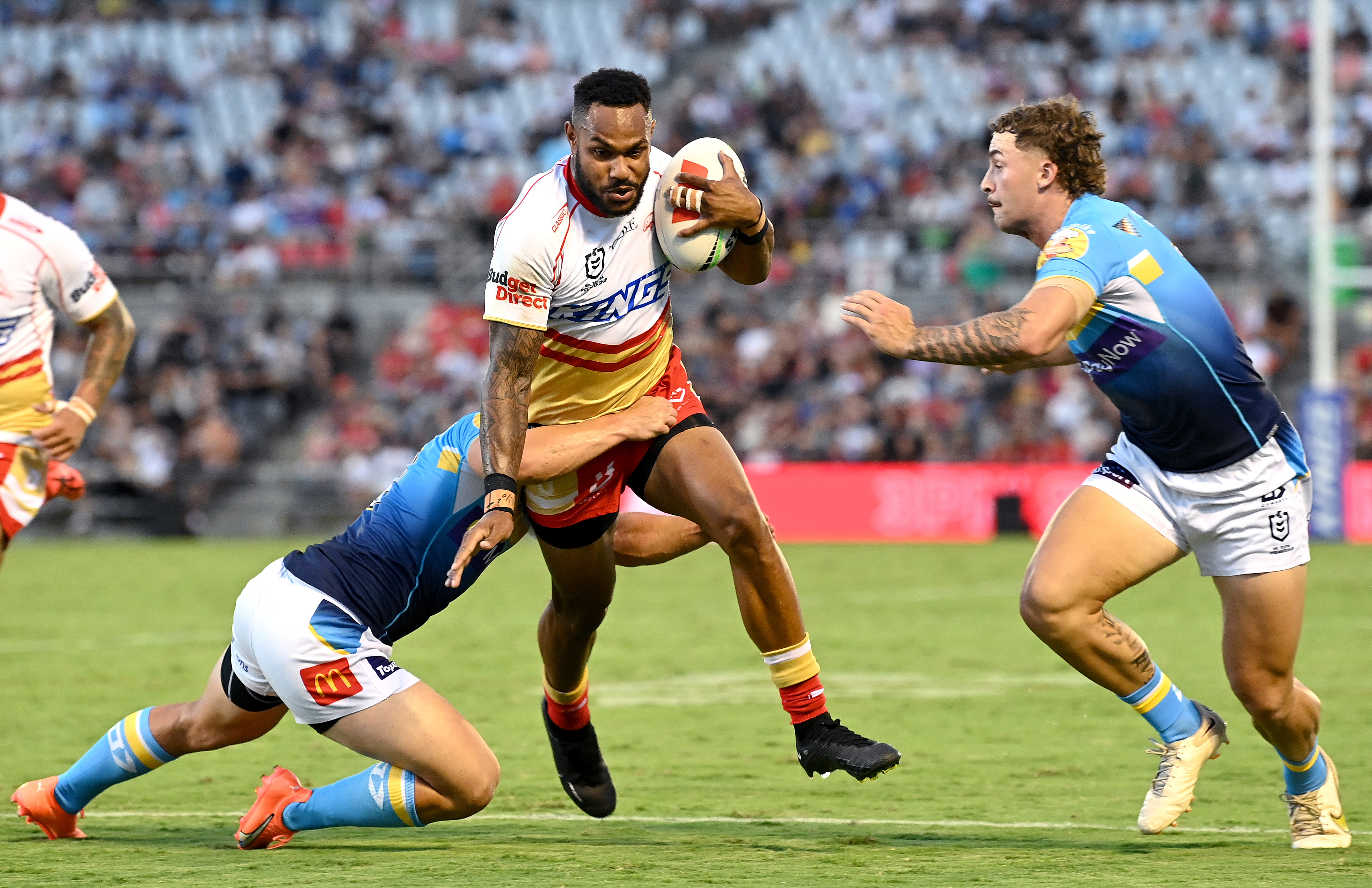 Hamiso Tabuai-Fidow of the Dolphins takes on the defence of the Gold Coast Titans. (Photo by Bradley Kanaris/Getty Images)