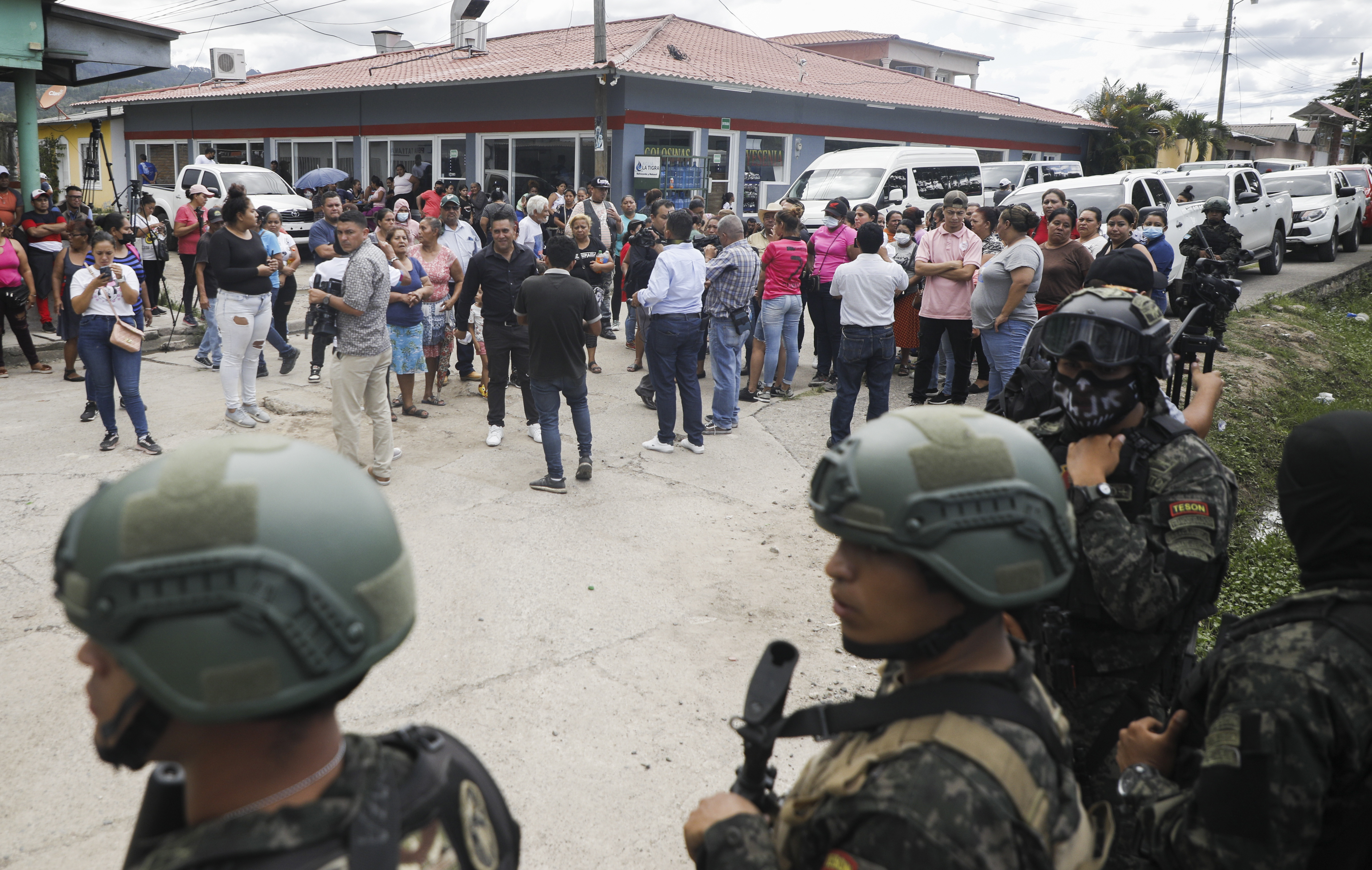Police guard the entrance to the women's prison in Tamara, on the outskirts of Tegucigalpa, Honduras, Tuesday, June 20, 2023. 