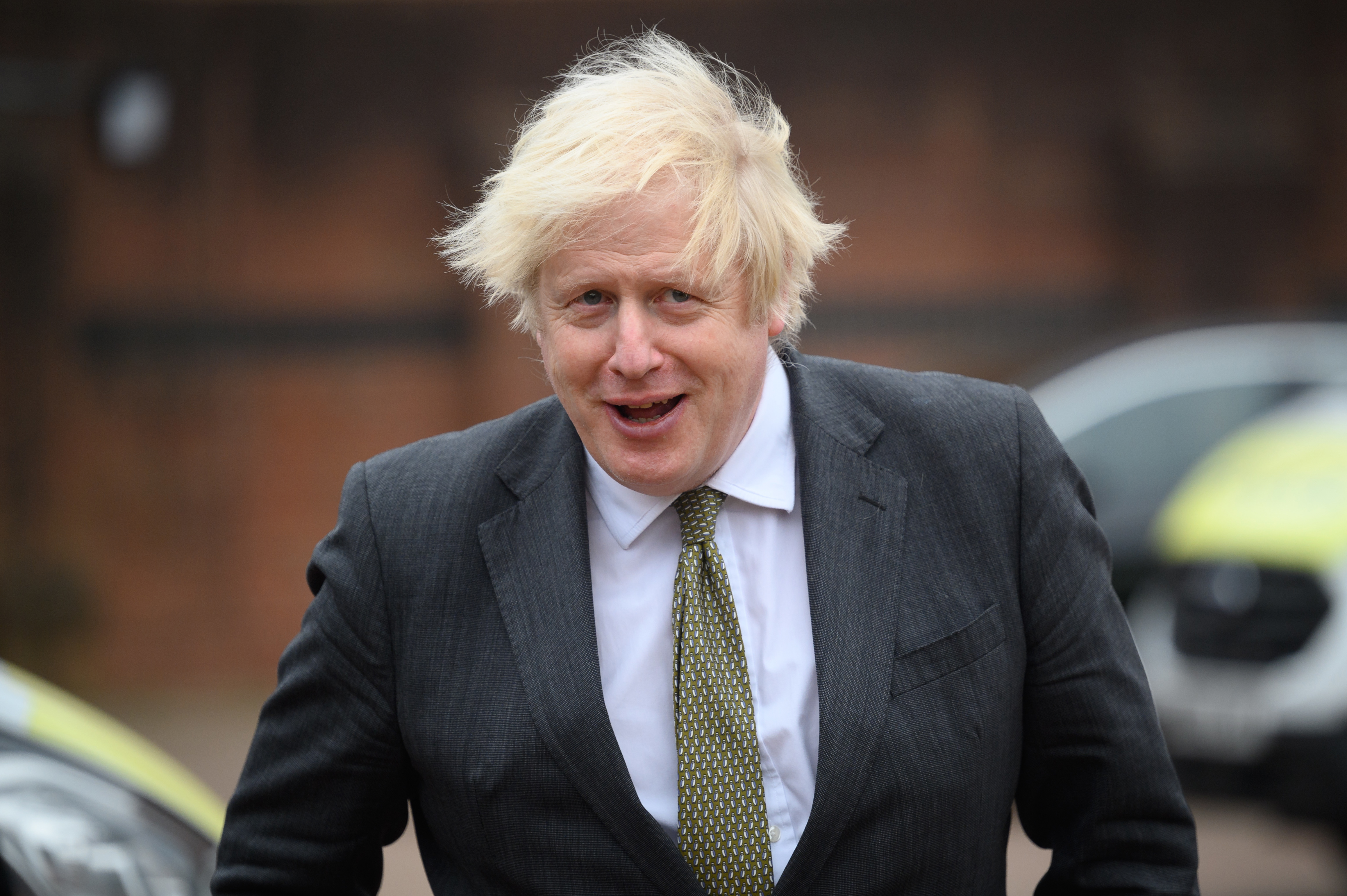 UXBRIDGE, ENGLAND - DECEMBER 17: Britain's Prime Minster Boris Johnson speaks with police officers as he makes a constituency visit to Uxbridge police station on December 17, 2021 in Uxbridge, England. (Photo by Leon Neal/Getty Images)