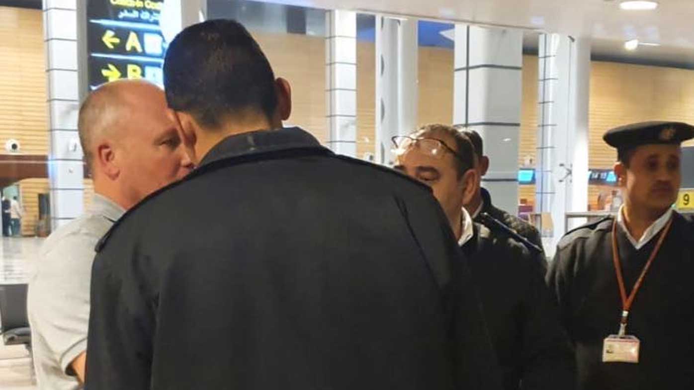 Tony Remo Camoccio is confronted by security officers after he patted one on the back.