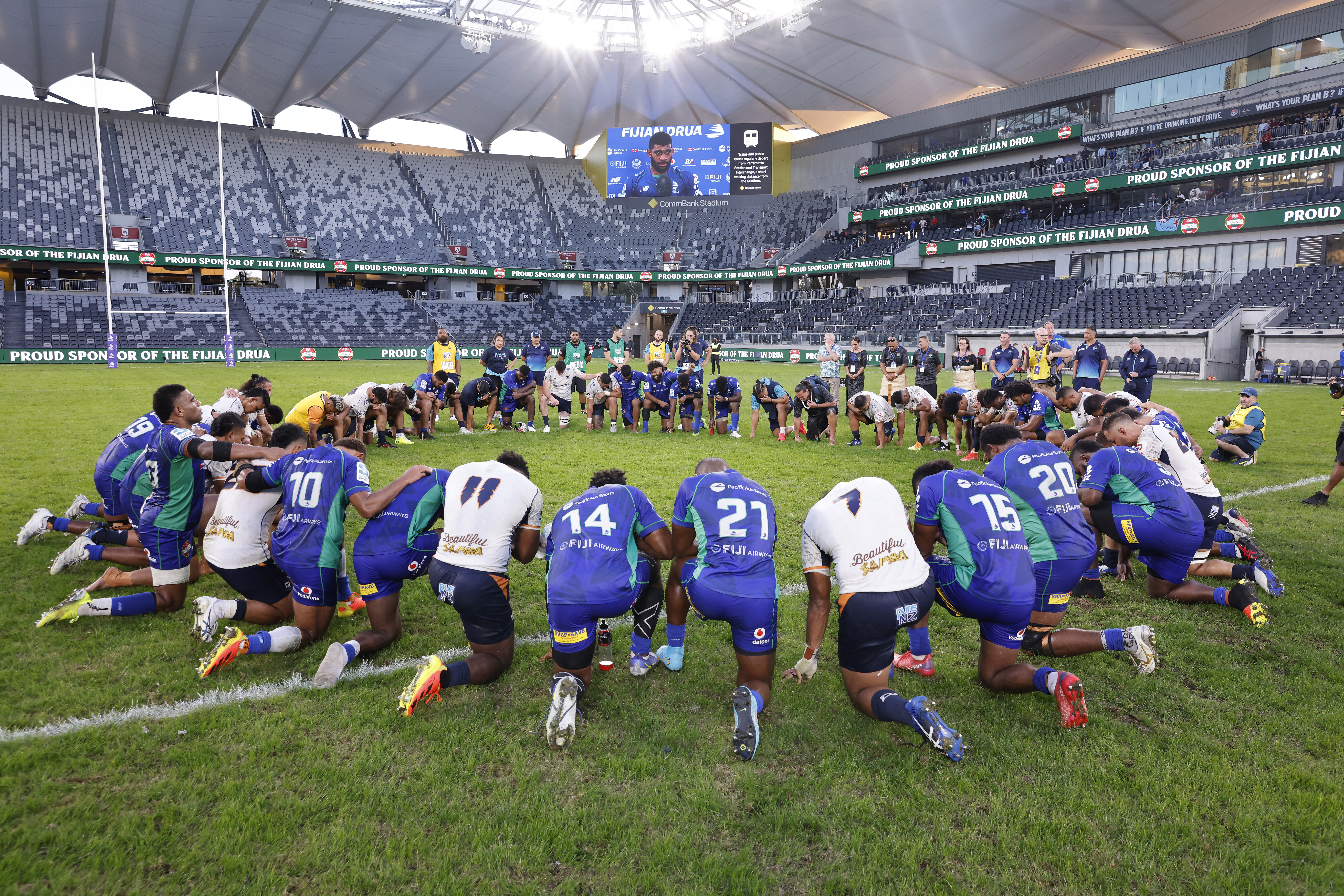 Teams join together in prayers after the Super Rugby Pacific match between the Fijian Drua and the Moana Pasifika.