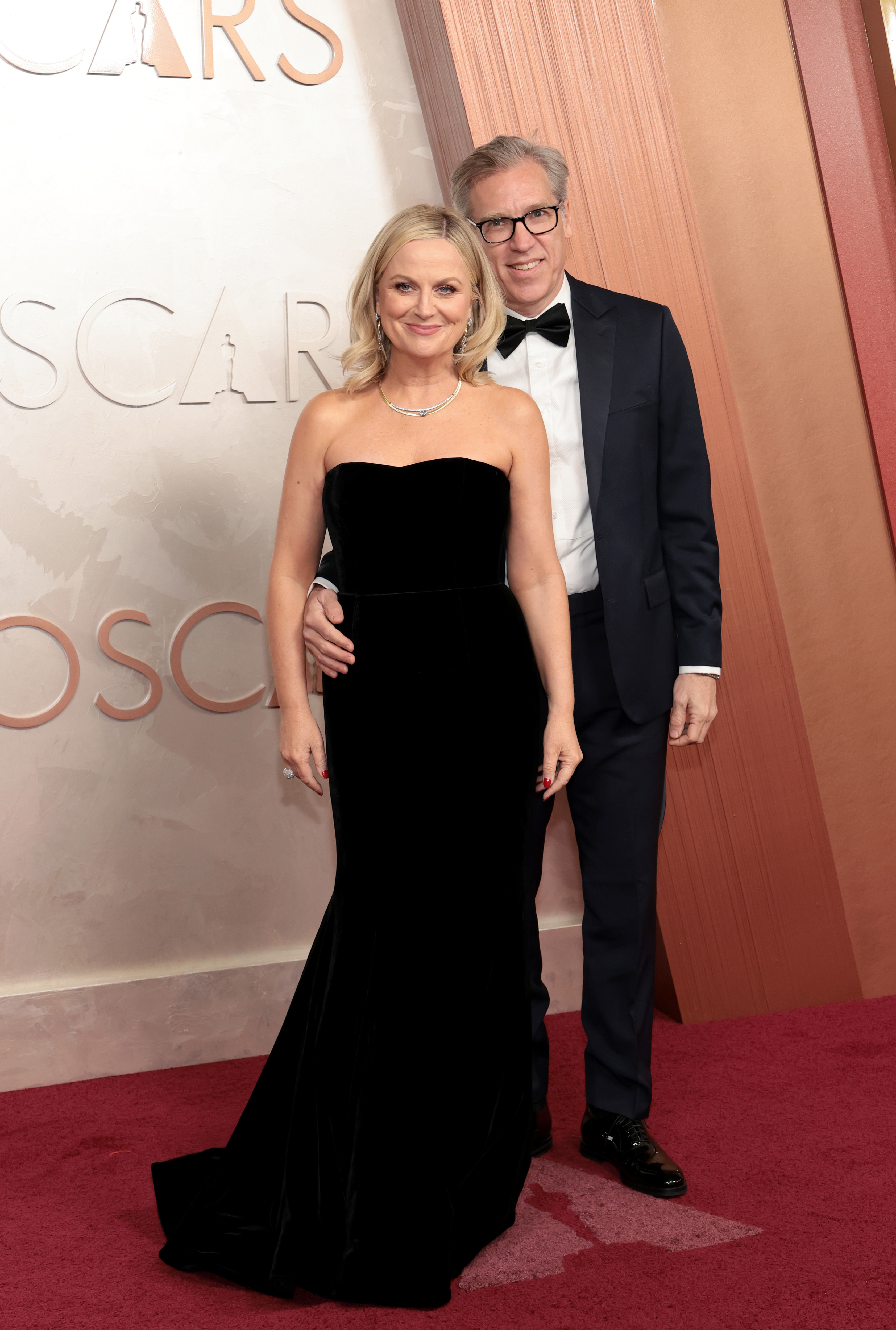 Amy Poehler and Joel Lovell attend the 97th Annual Oscars at Dolby Theatre on March 02, 2025 in Hollywood, California. 
