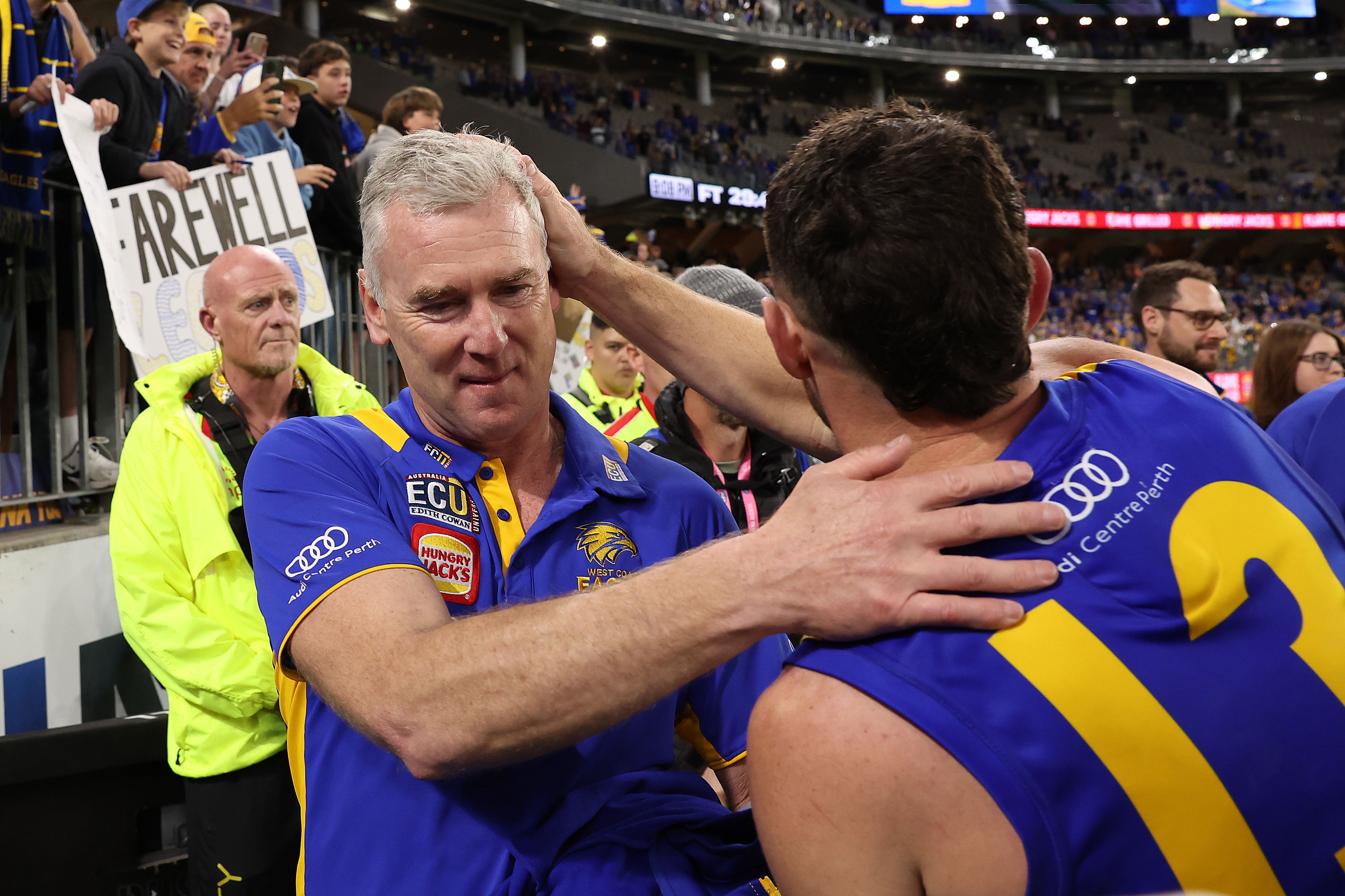 PERTH, AUSTRALIA - AUGUST 26: Adam Simpson, head coach of the Eagles shares a moment with Luke Shuey following the round 24 AFL match between the West Coast Eagles and Adelaide Crows at Optus Stadium, on August 26, 2023, in Perth, Australia. (Photo by Paul Kane/Getty Images)