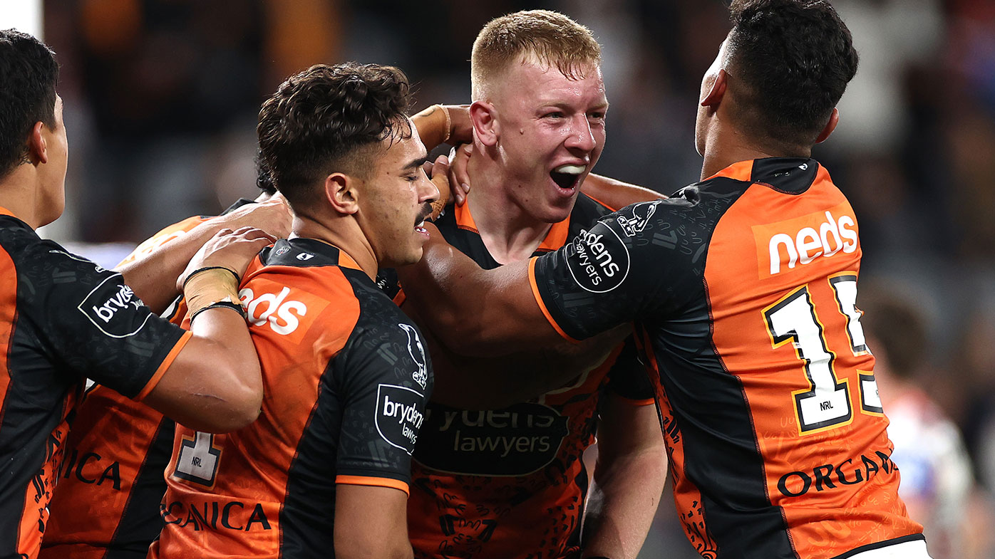 Alex Seyfarth of the Tigers celebrates with team mates after scoring a try during the round 12 NRL match between the Wests Tigers and the St George Illawarra Dragons at Bankwest Stadium on May 28, 2021, in Sydney, Australia. (Photo by Cameron Spencer/Getty Images)