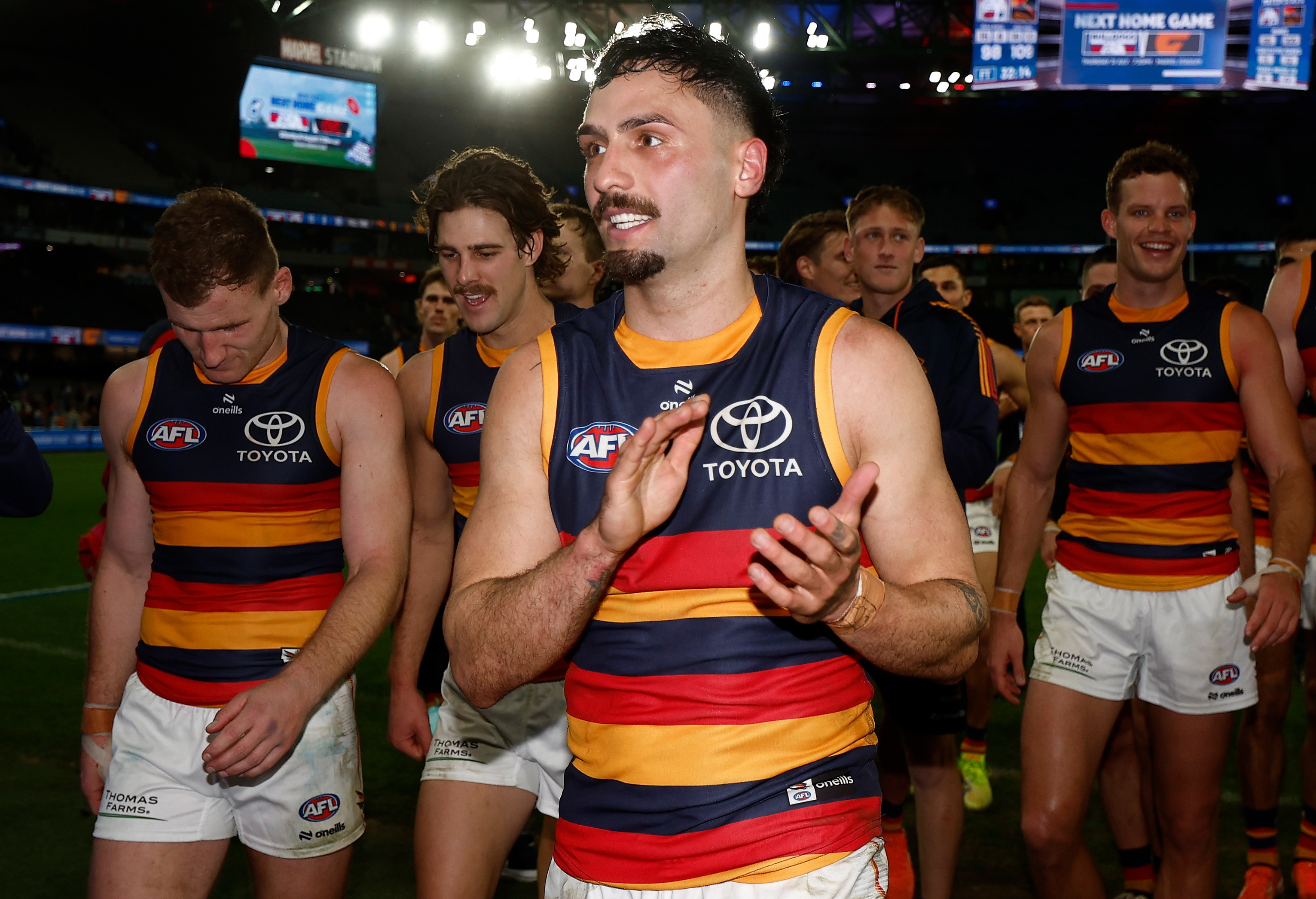MELBOURNE, AUSTRALIA - JULY 12: Izak Rankine of the Crows celebrates after his 100th match during the 2025 AFL Round 18 match between the Western Bulldogs and the Adelaide Crows at Marvel Stadium on July 12, 2025 in Melbourne, Australia. (Photo by Michael Willson/AFL Photos via Getty Images)
