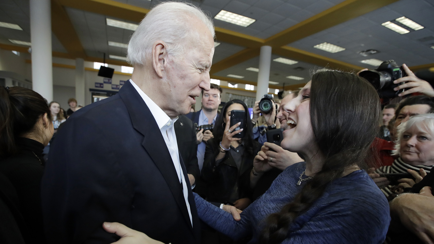Former Vice President Joe Biden meets a supporter in Iowa.