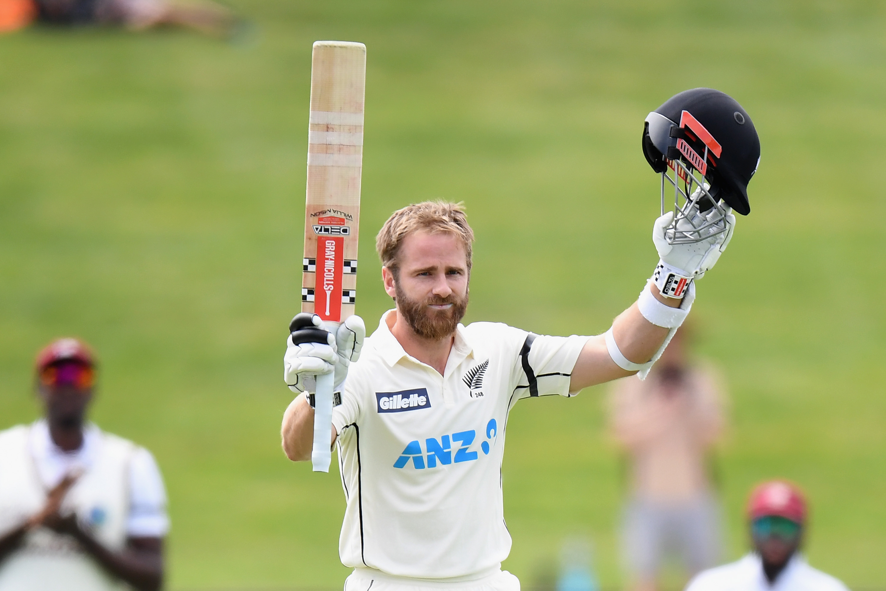 Kane Williamson of New Zealand celebrates his century at Seddon Park.