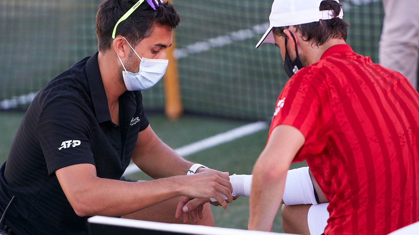 Dominic Thiem of Austria receives medical treatment during his Round of 16 match against Adrian Mannarino of France on day four of the Mallorca Championships.