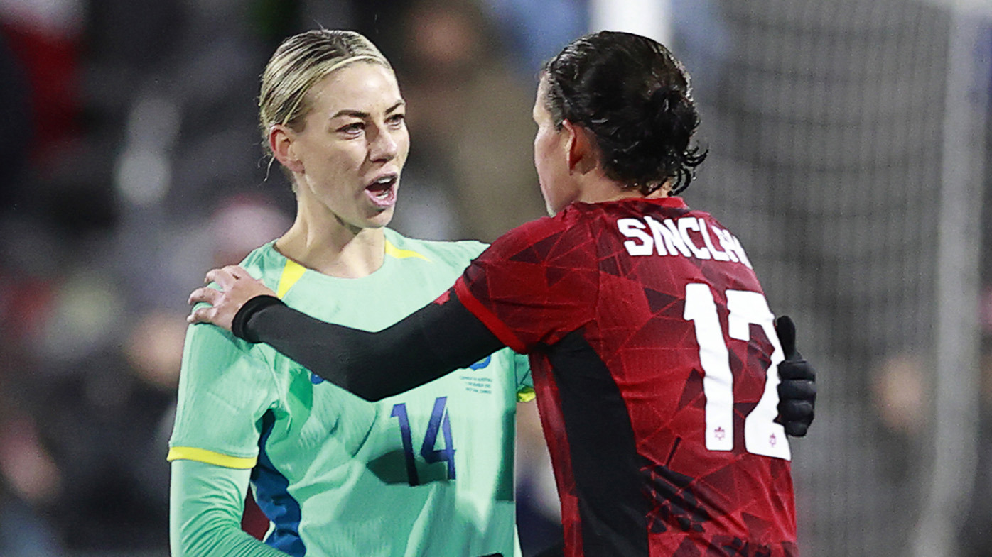 Australia's Alanna Kennedy (left) congratulates Christine Sinclair after the Matildas were thumped by Canada 5-0.