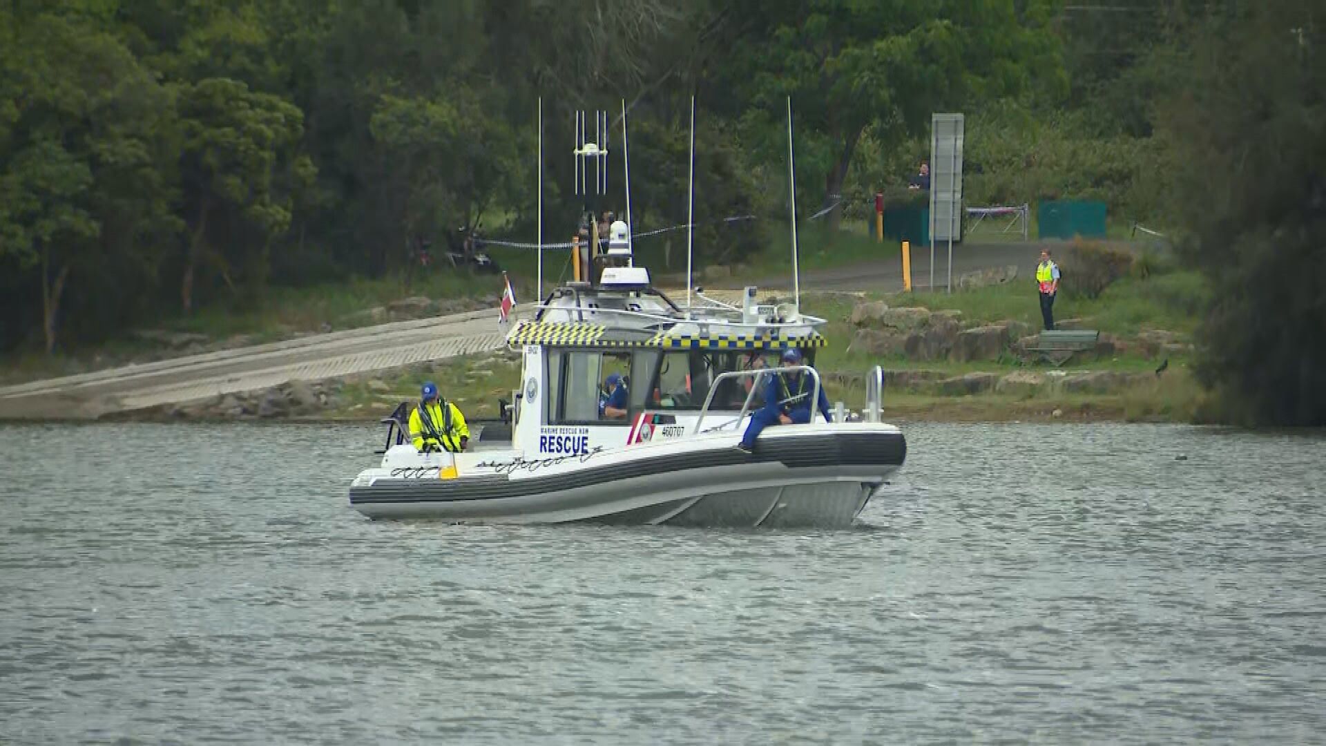 A woman has died and p﻿olice are urgently searching for two children in a south-west Sydney bay, after they were seen in distress in the water. Police were called to a boat ramp on Floyd Bay, in Lansvale after reports of a woman and two children in distress in the water.