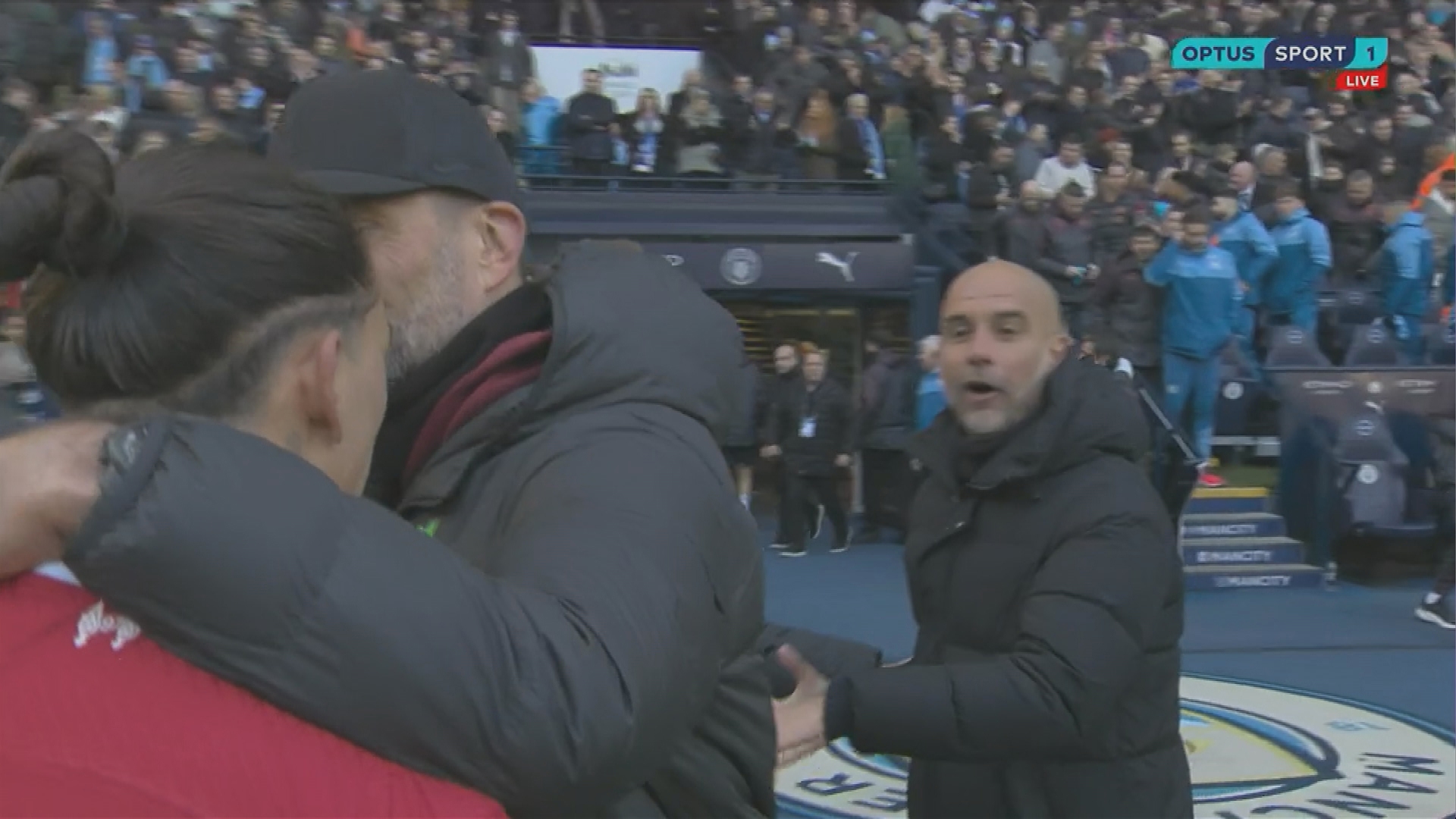 Liverpool manager Jurgen Klopp separates Darwin Nunez from Manchester City manager Pep Guardiola.