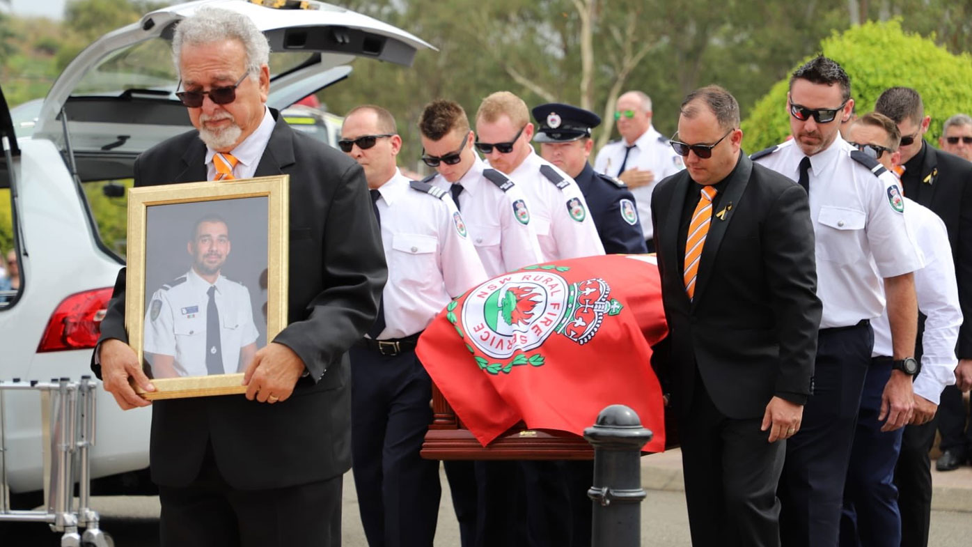 His coffin was draped in a bright red RFS flag.