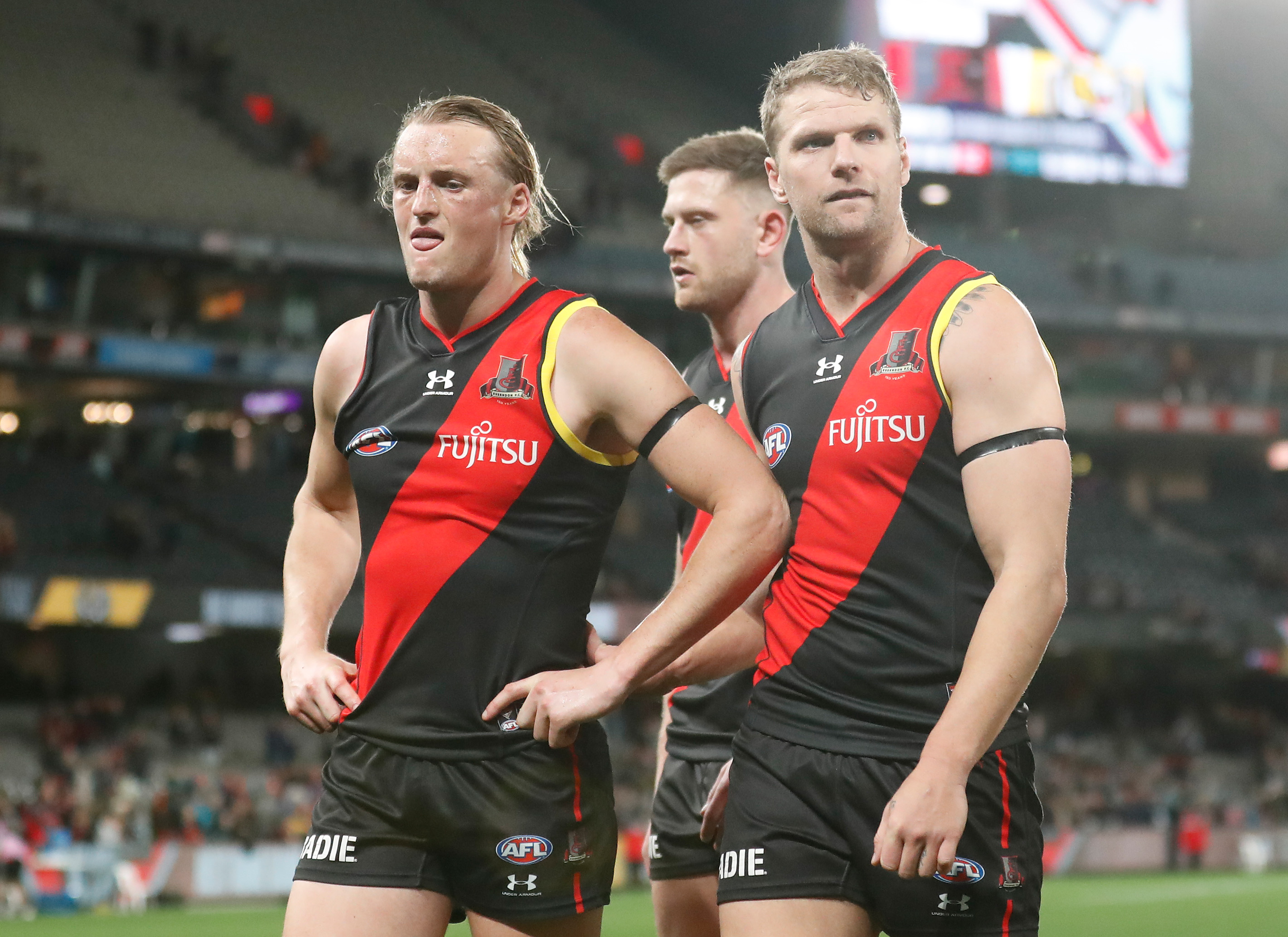 Mason Redman and Jake Stringer of the Bombers look dejected after a loss.