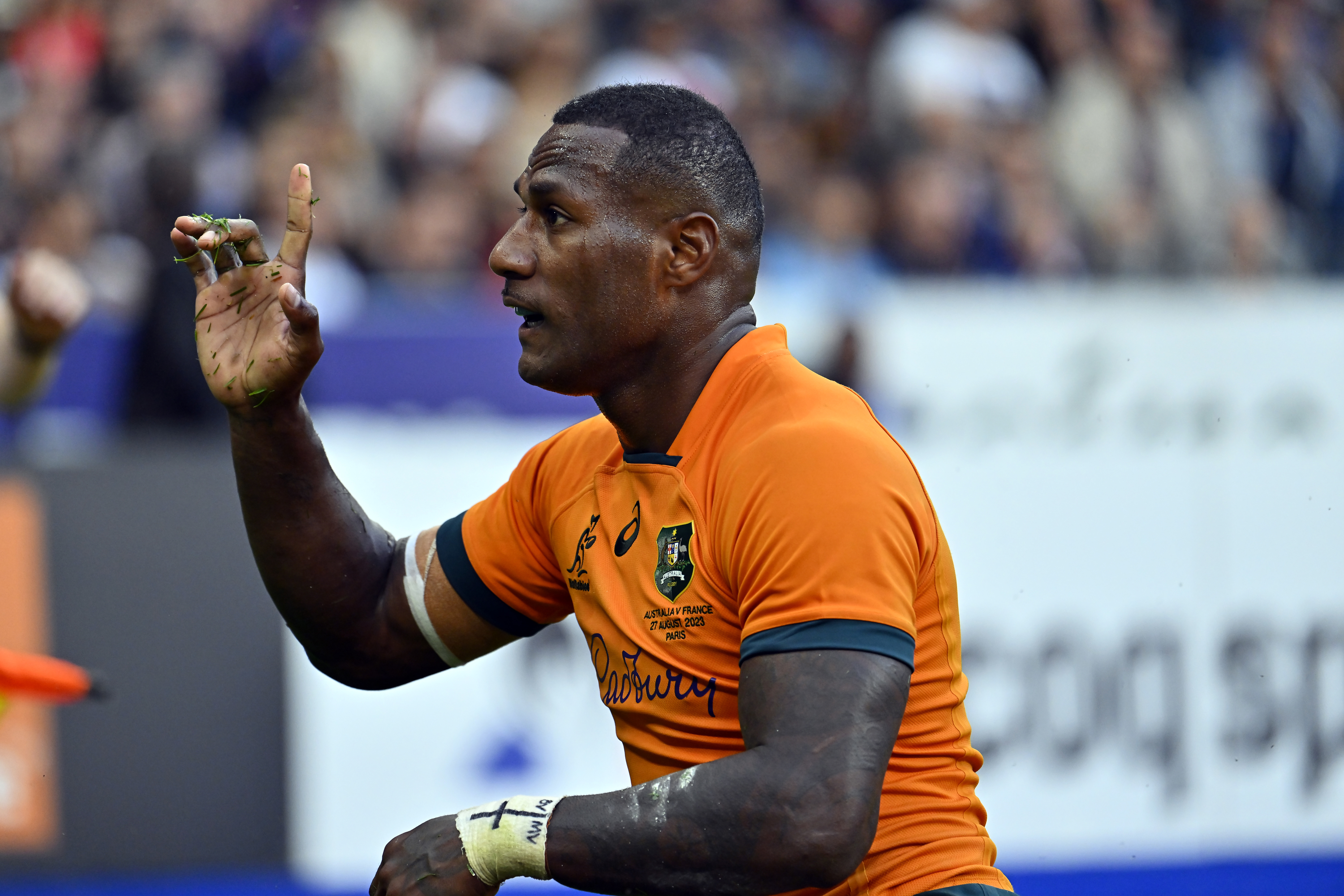 Suliasi Vunivalu of Australia reacts after scoring a try.