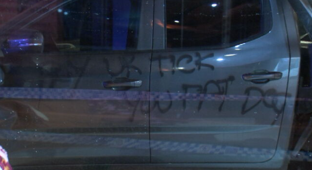 A threatening message was spray painted on the side of the ute.