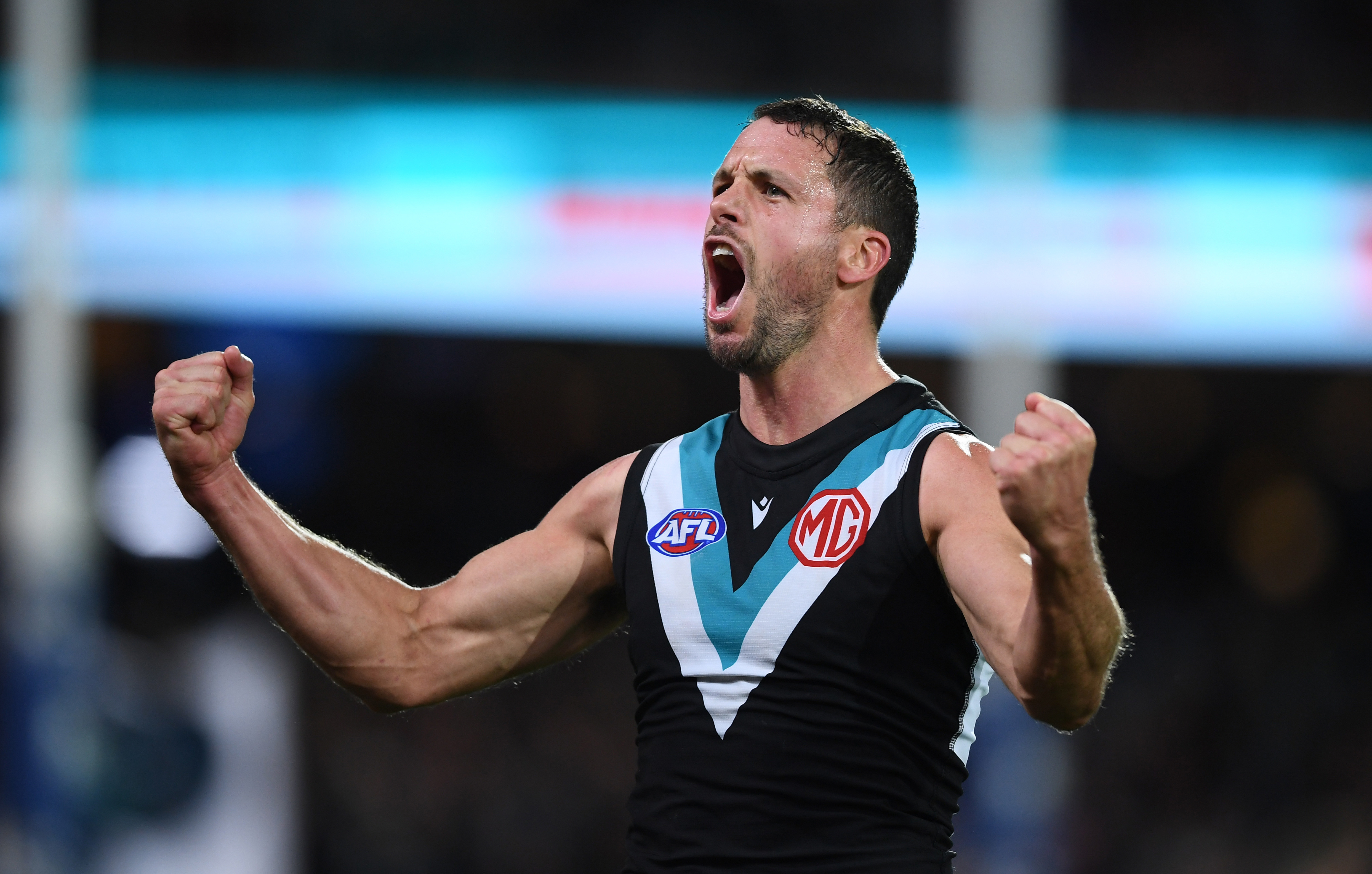 ADELAIDE, AUSTRALIA - MAY 06: Travis Boak of Port Adelaide   celebrates a goal during the round eight AFL match between the Port Adelaide Power and the Western Bulldogs at Adelaide Oval on May 06, 2022 in Adelaide, Australia. (Photo by Mark Brake/Getty Images)