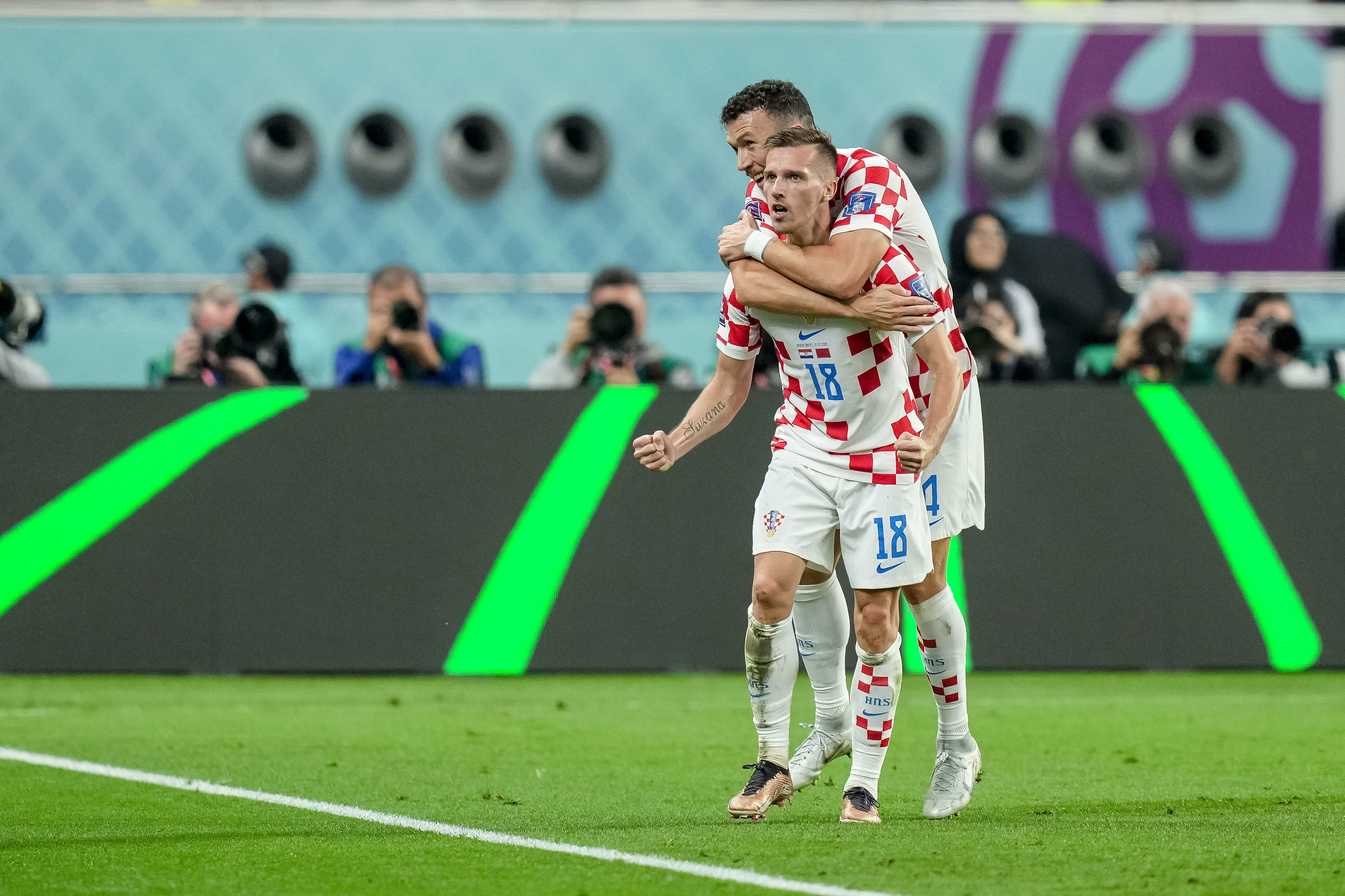 Mislav Orsic of Croatia celebrates after scoring his team's second goal with Ivan Perisic of Croatia during the FIFA World Cup Qatar 2022 3rd Place match between Croatia and Morocco at Khalifa International Stadium on December 17, 2022 in Doha, Qatar. (Photo by Mohammad Karamali/DeFodi Images via Getty Images)