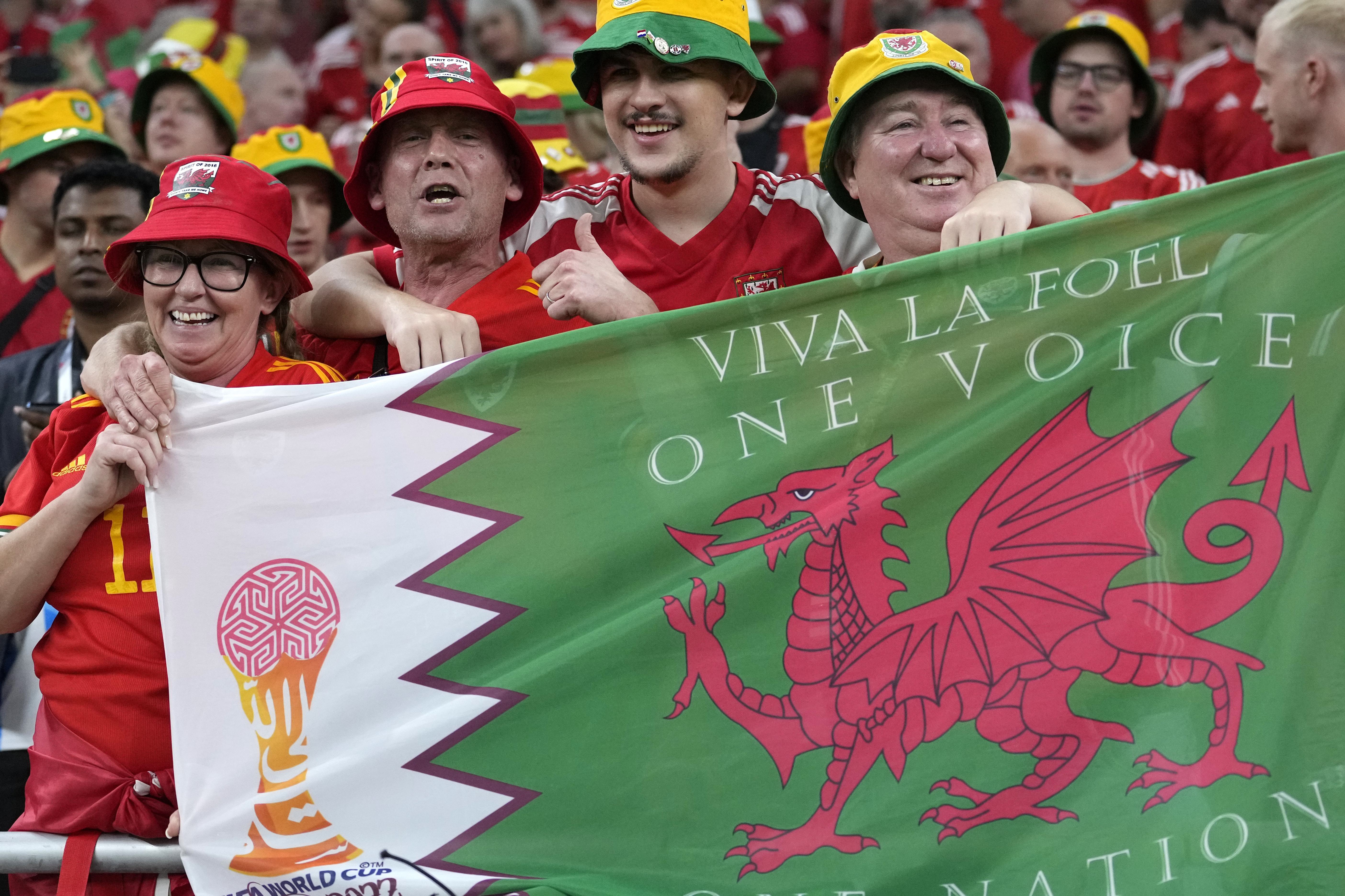 Fans cheer ahead the World Cup, group B soccer match between the United States and Wales, at the Ahmad Bin Ali Stadium in in Doha, Qatar, Monday, Nov. 21, 2022