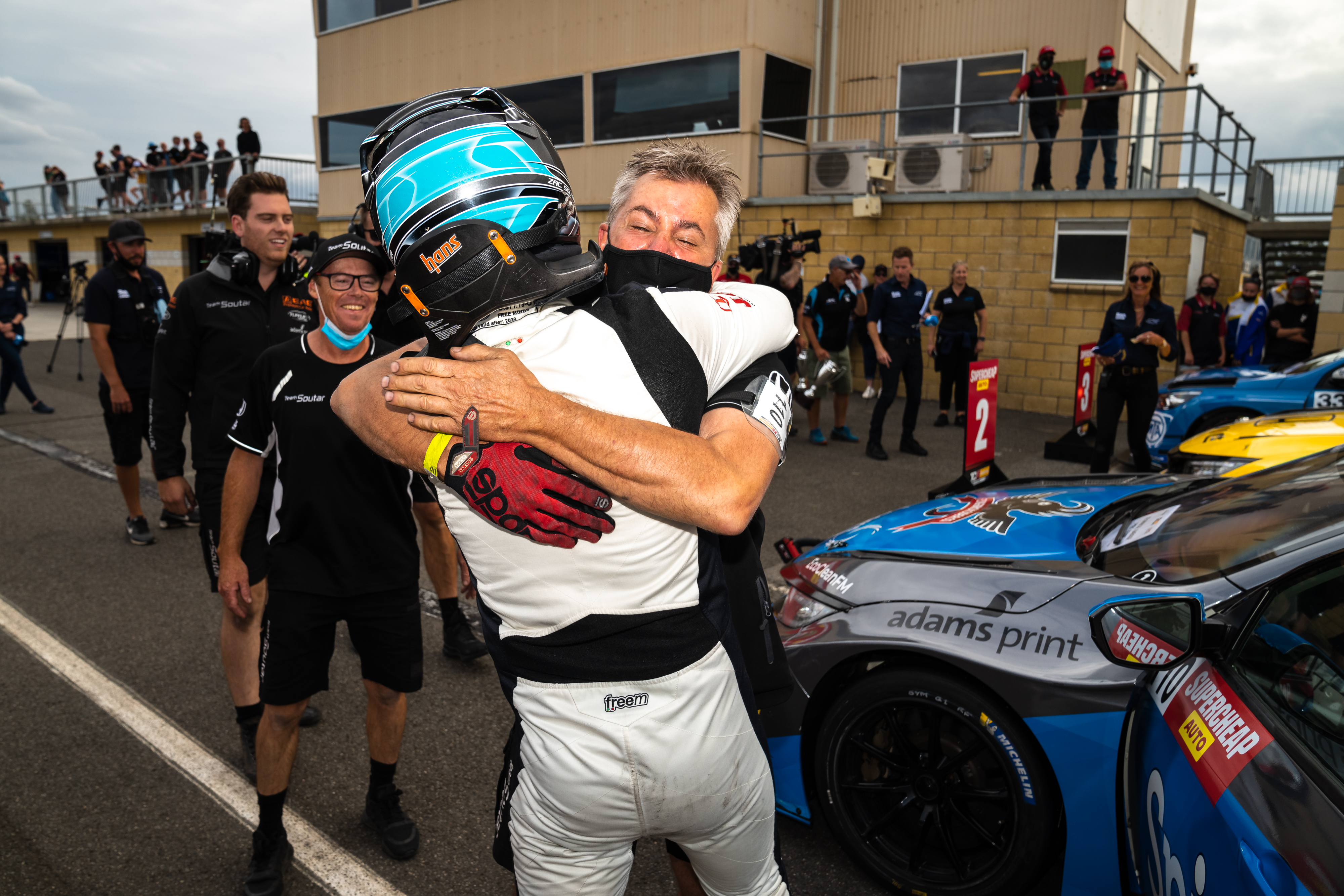 Zac Soutar embraces his father after scoring his first TCR Australia Series win at Symmons Plains.
