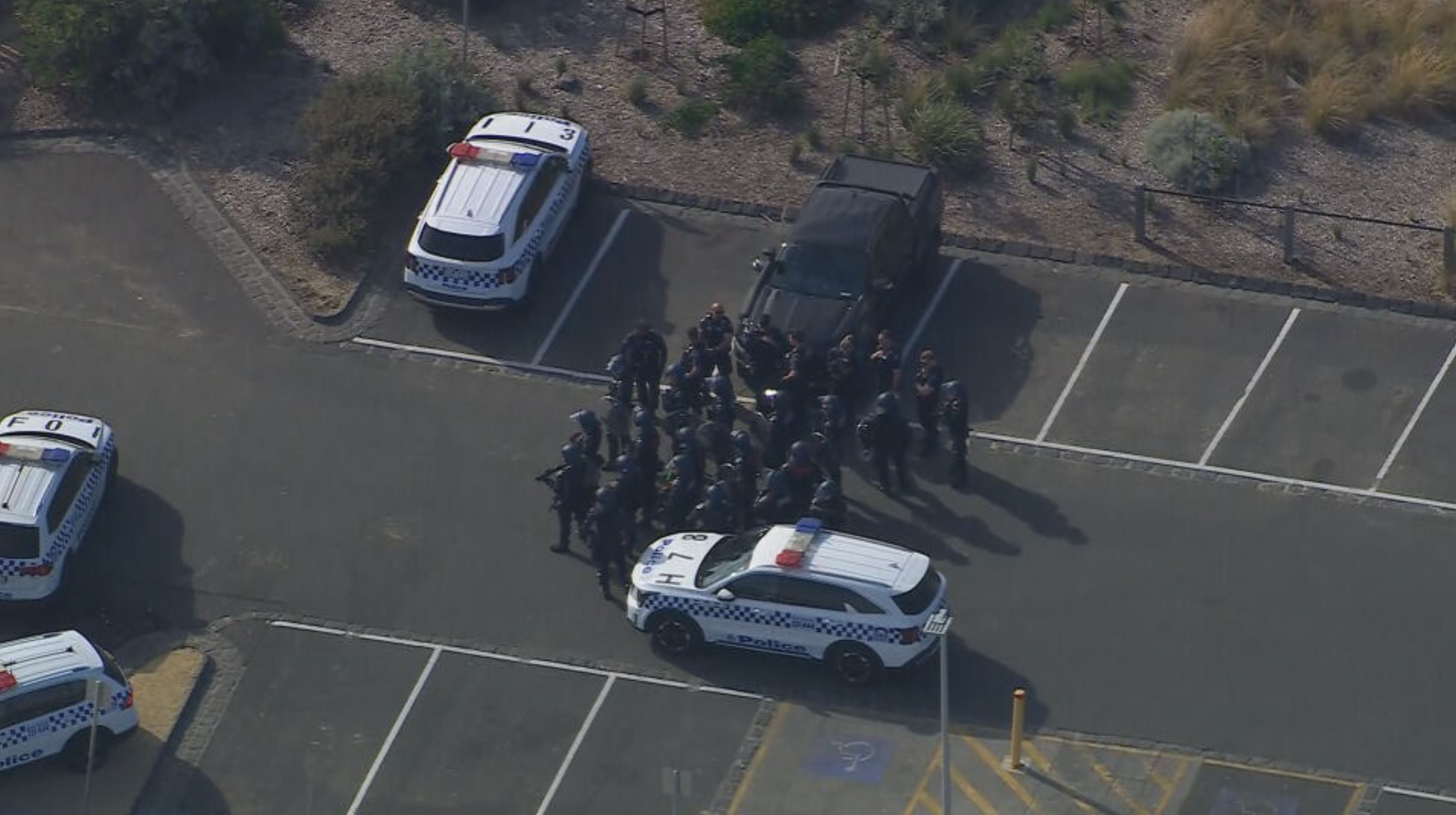 Riot police were seen preparing to patrol the beach.