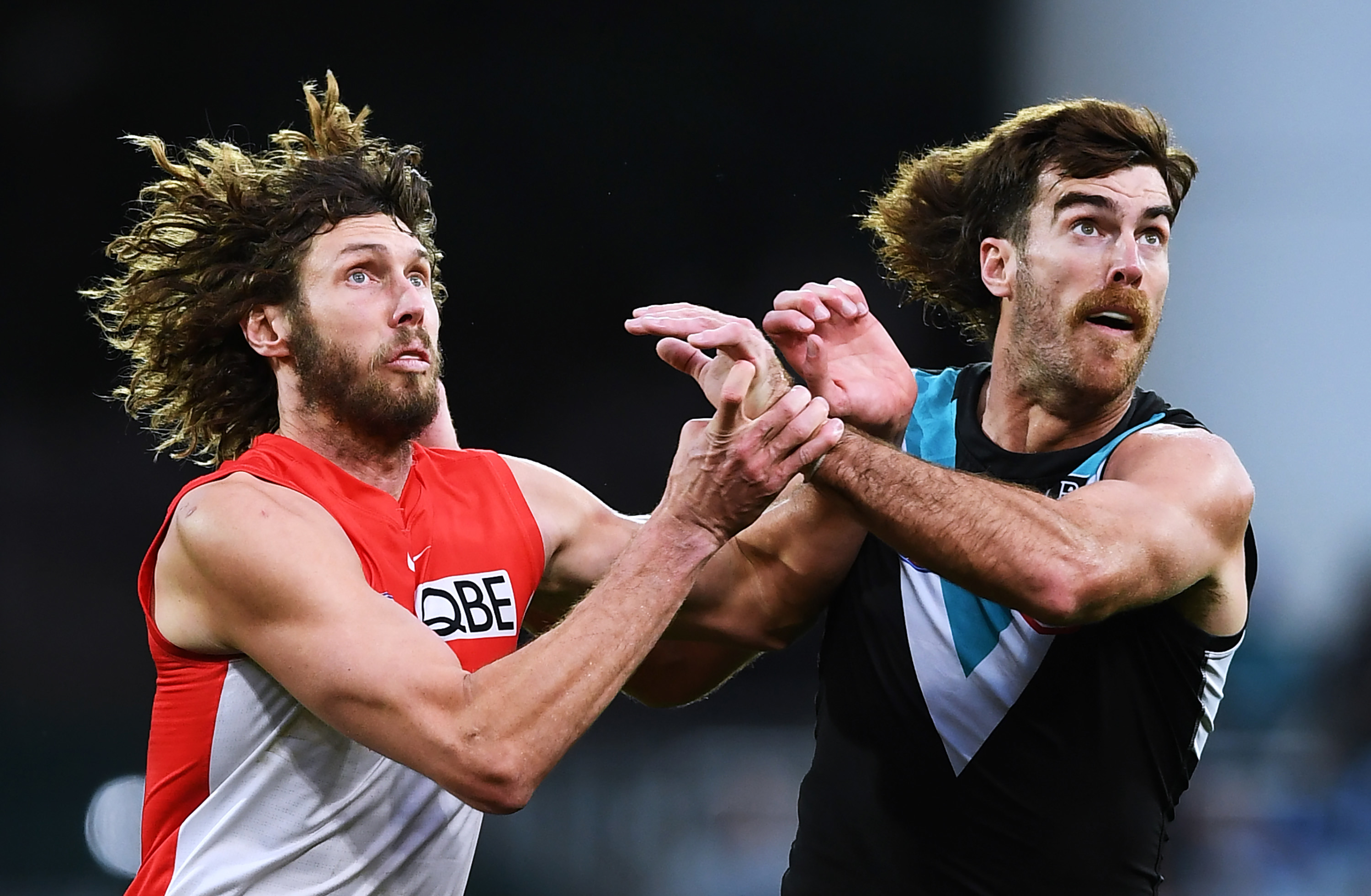 ADELAIDE, AUSTRALIA - JUNE 26: Tom Hickey of the Swans rucks against Scott Lycett of Port Adelaide during the round 15 AFL match between the Port Adelaide Power and the Sydney Swans at Adelaide Oval on June 26, 2021 in Adelaide, Australia. (Photo by Mark Brake/Getty Images)