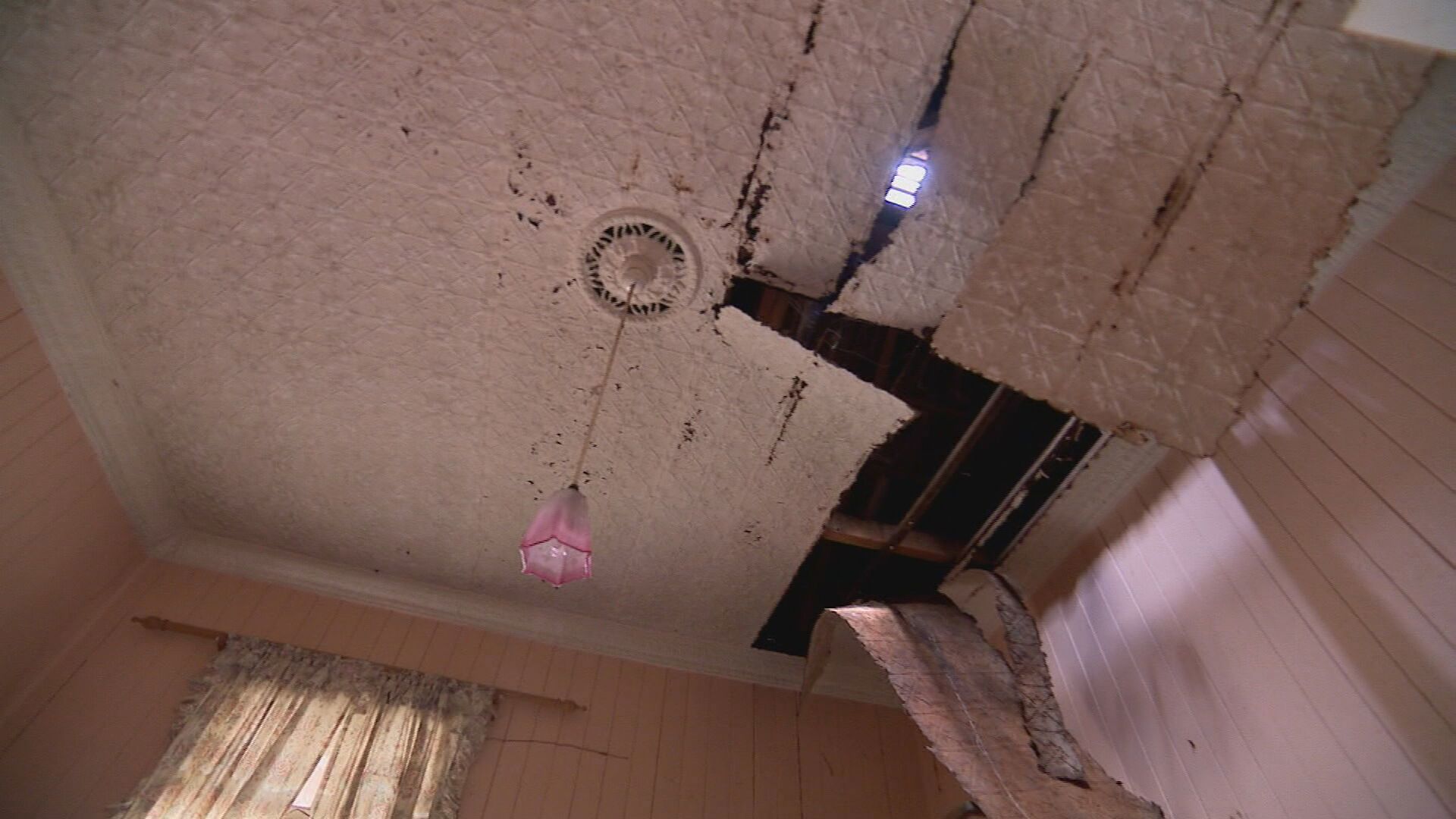 The home has holes in the roof and floor.