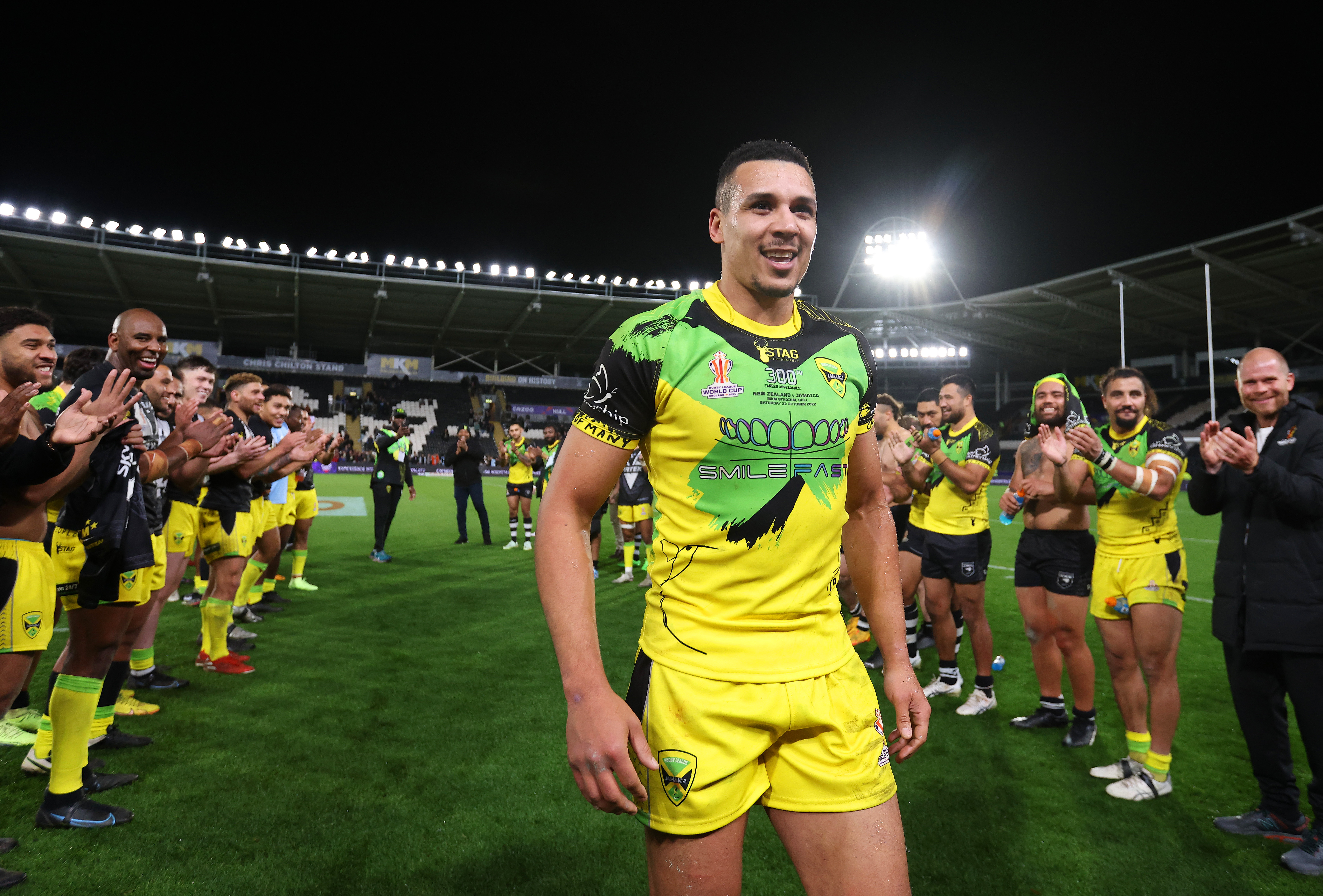 Ben Jones-Bishop of Jamaica  receives a guard of honour from their teammates after their sides defeat during the Rugby League World Cup 2021 Pool C match between New Zealand and Jamaica at MKM Stadium on October 22, 2022 in Hull, England. (Photo by George Wood/Getty Images for RLWC)