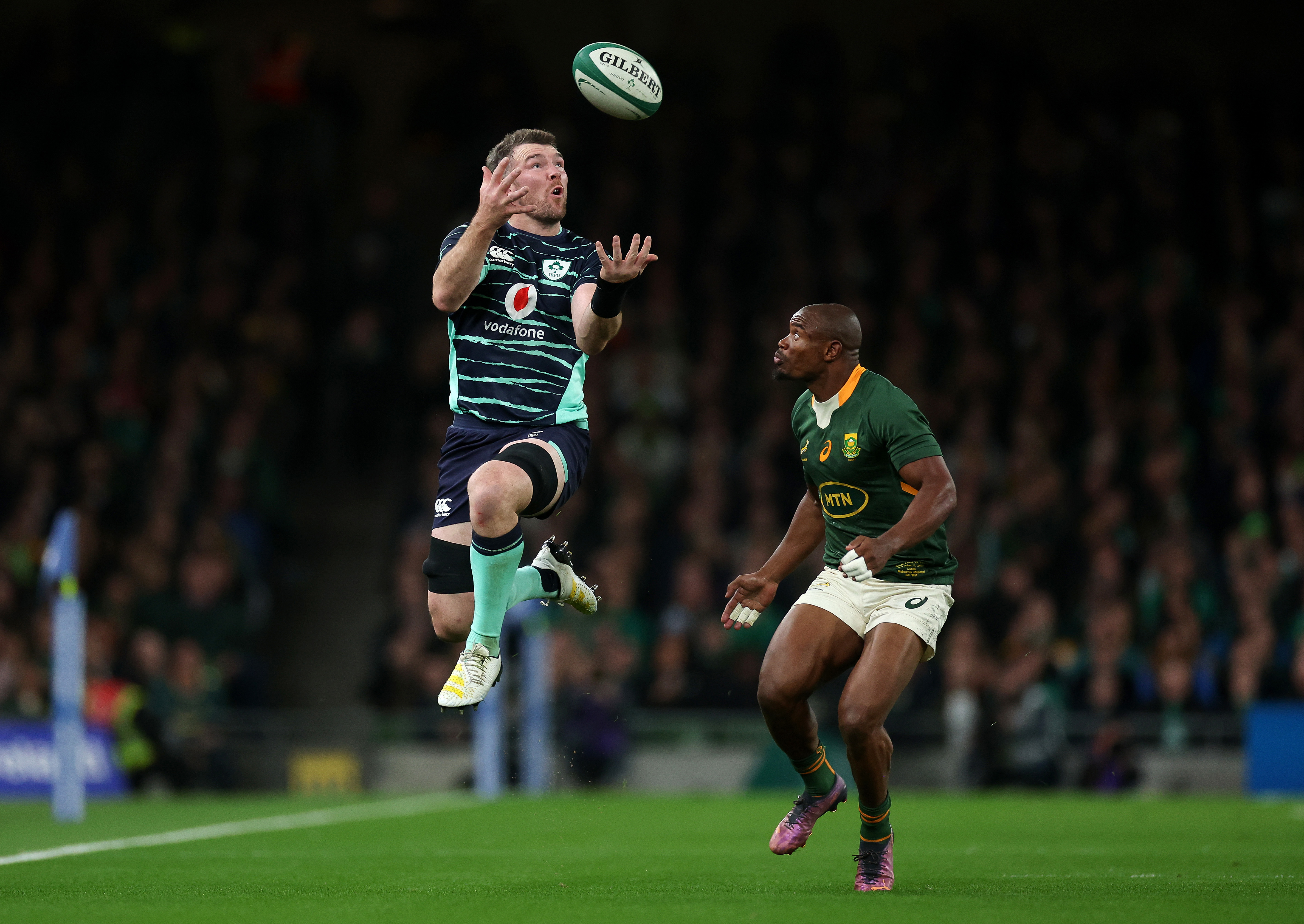 Peter O'Mahony of Ireland is tackled by Makazole Mapimpi of South Africa during the Autumn International in 2022.