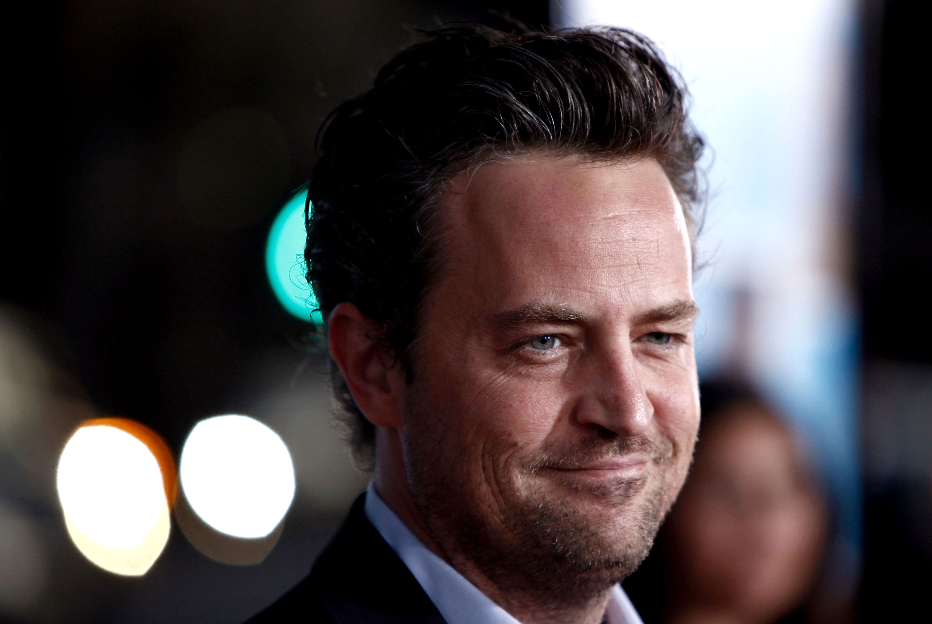 Matthew Perry, seen here arriving to a movie premiere in 2009, died Saturday.