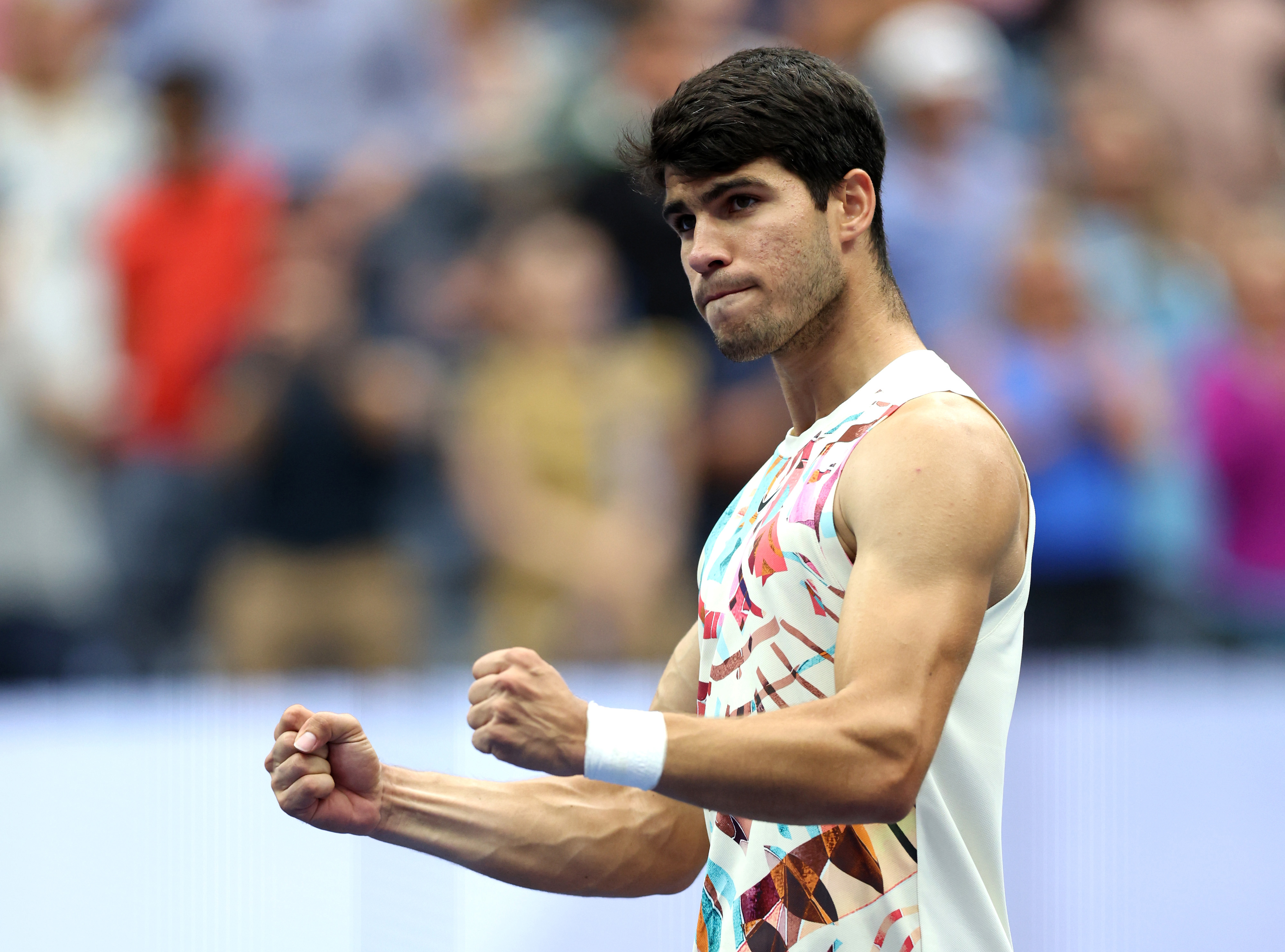 Carlos Alcaraz of Spain celebrates match point against Matteo Arnaldi of Italy during their Men's Singles Fourth Round match on Day Eight of the 2023 US Open at the USTA Billie Jean King National Tennis Center on September 04, 2023 in the Flushing neighborhood of the Queens borough of New York City. (Photo by Clive Brunskill/Getty Images)