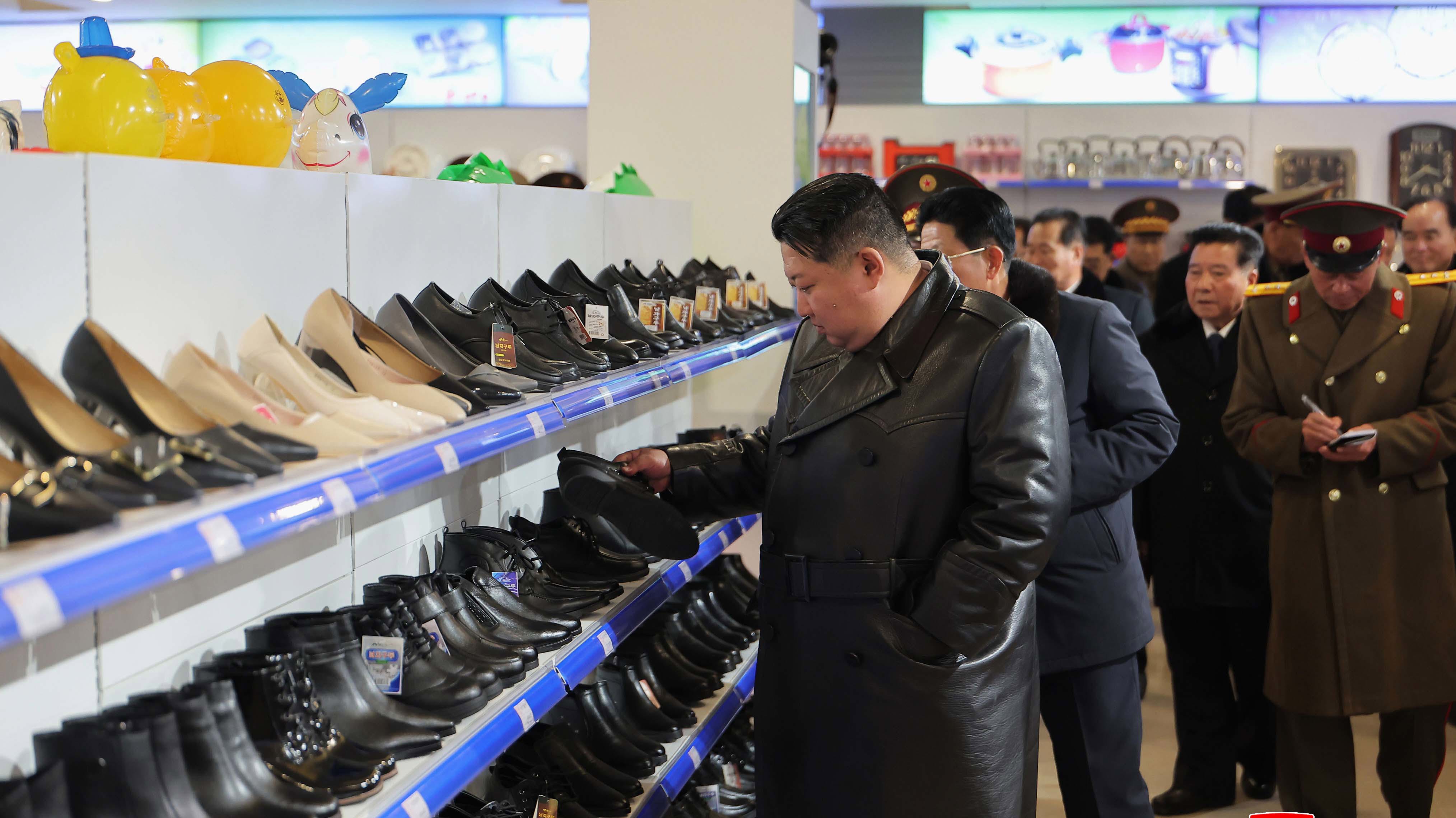 In this photo provided by the North Korean government, its leader Kim Jong Un inspects a completed shopping center in Chongpyong county, North Korea.