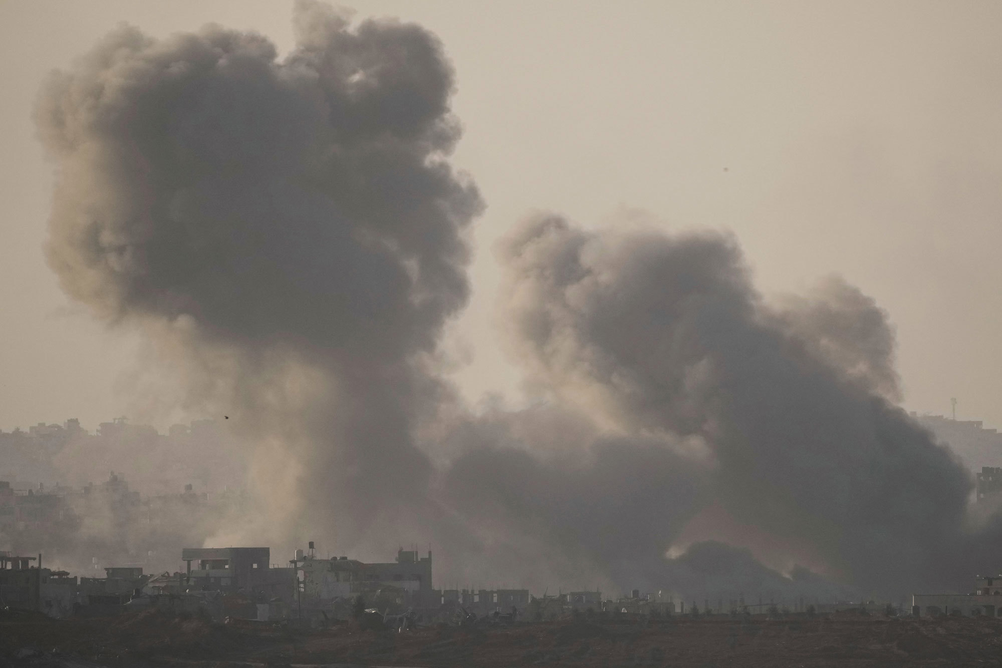 Smoke rises following an Israeli bombardment in the Gaza Strip, as seen from southern Israel, Saturday, Dec. 2, 2023.