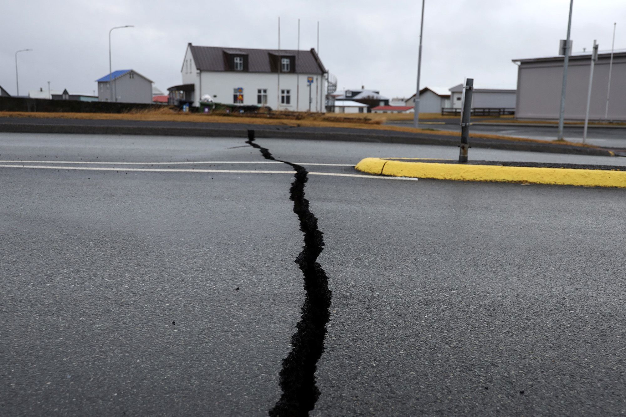 Cracks caused by volcanic activity emerge on a road in Grindavík, Iceland on November 11.