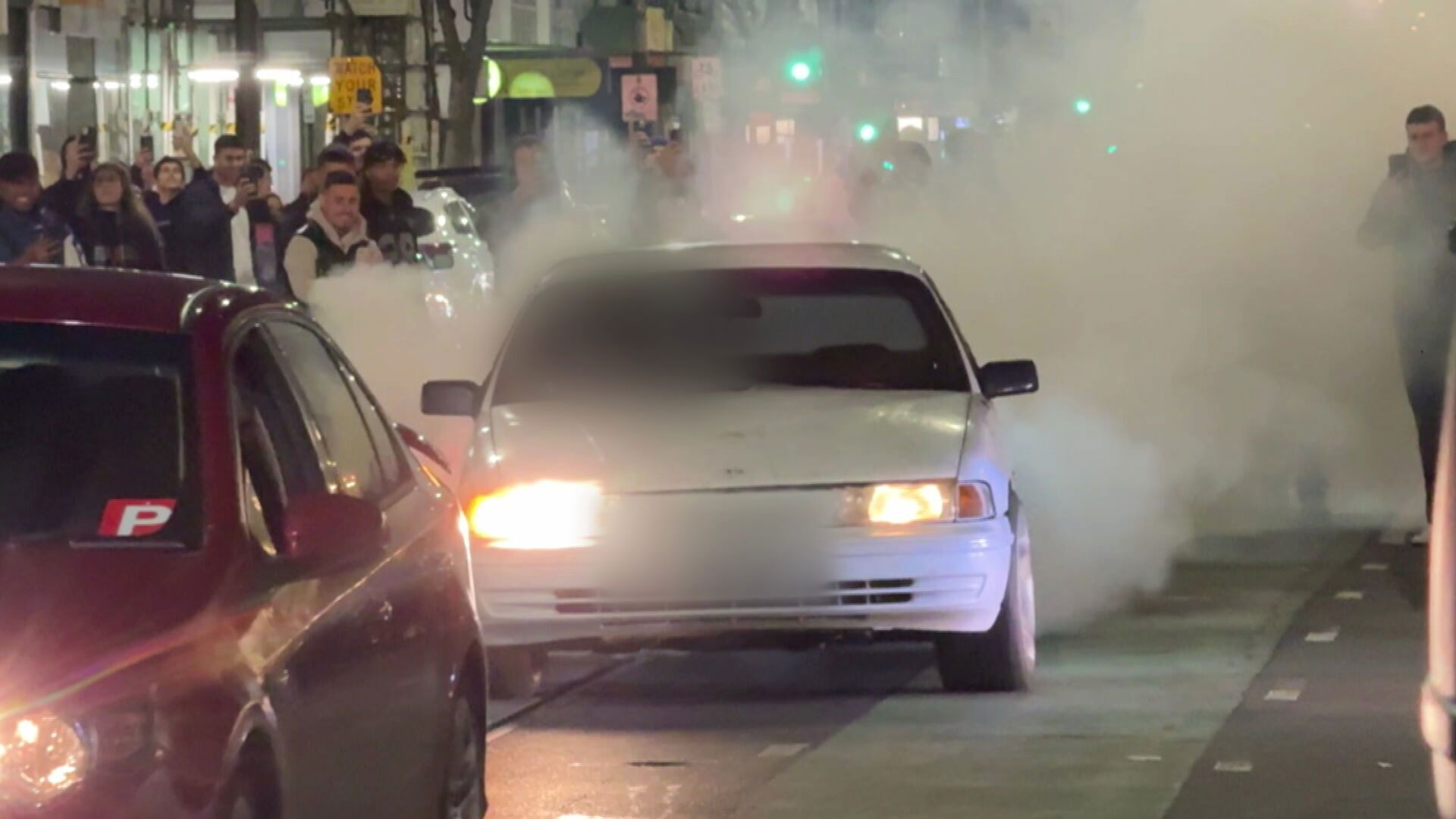 Chaos as car hoons takeover iconic Melbourne strip
