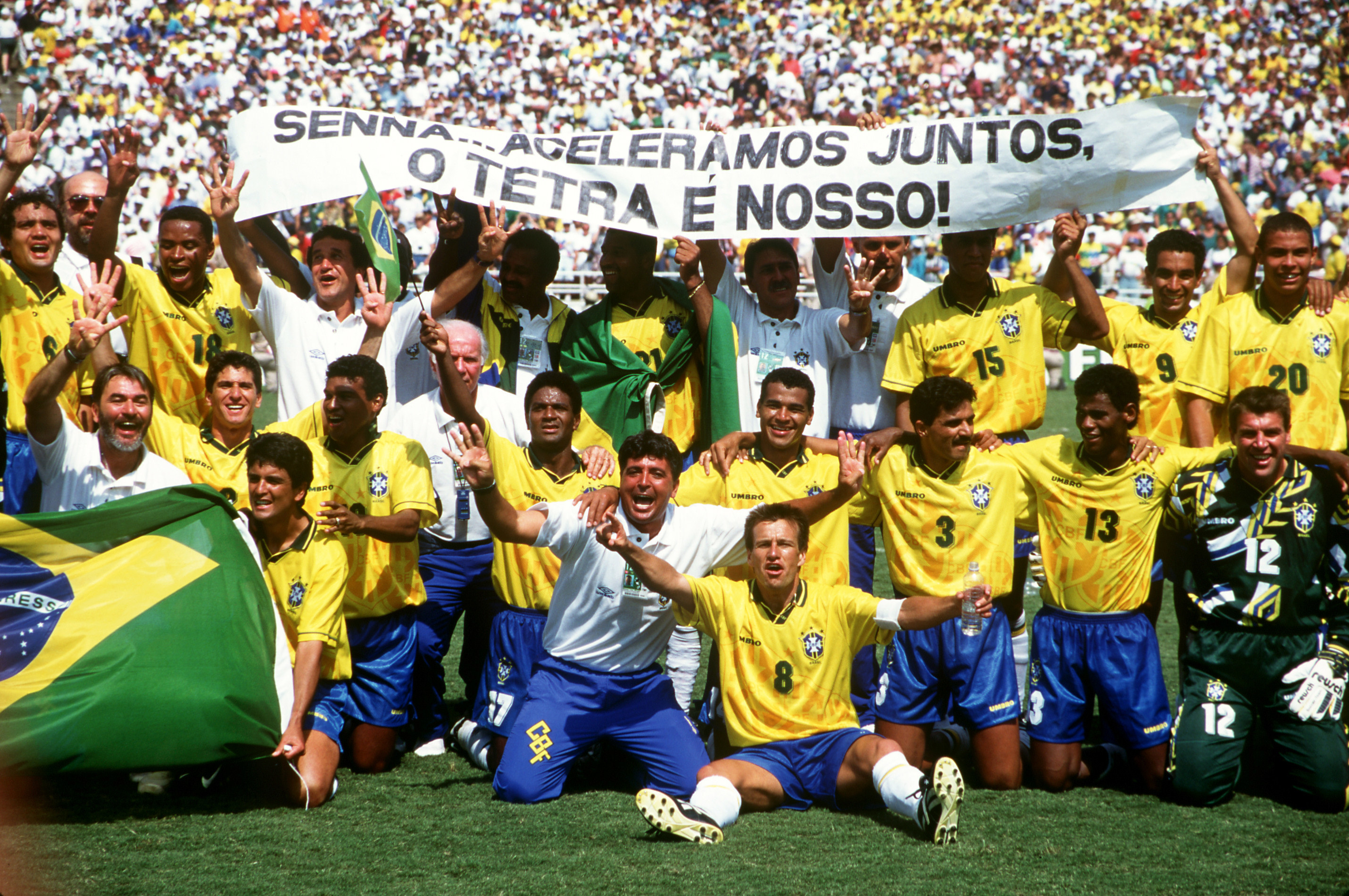 The victorious Brazilian team celebrate winning the final with a banner in memory of the Brazilian Formula One star, Ayrton Senna who was killed in San Marino in May. (Photo by Peter Robinson/EMPICS via Getty Images)