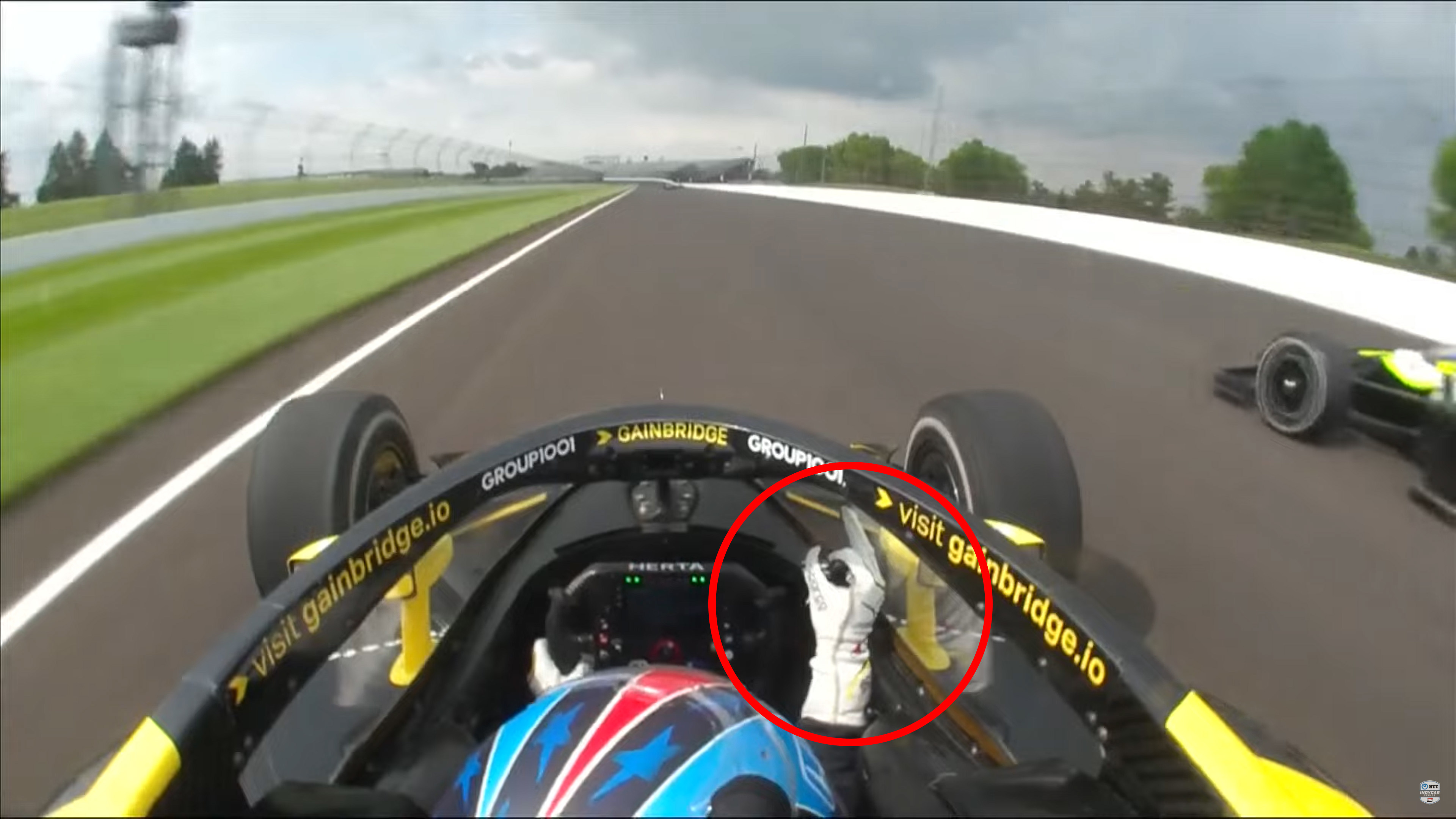 Colton Herta pokes his middle finger at Christian Rasmussen in practice at the Indianapolis 500.