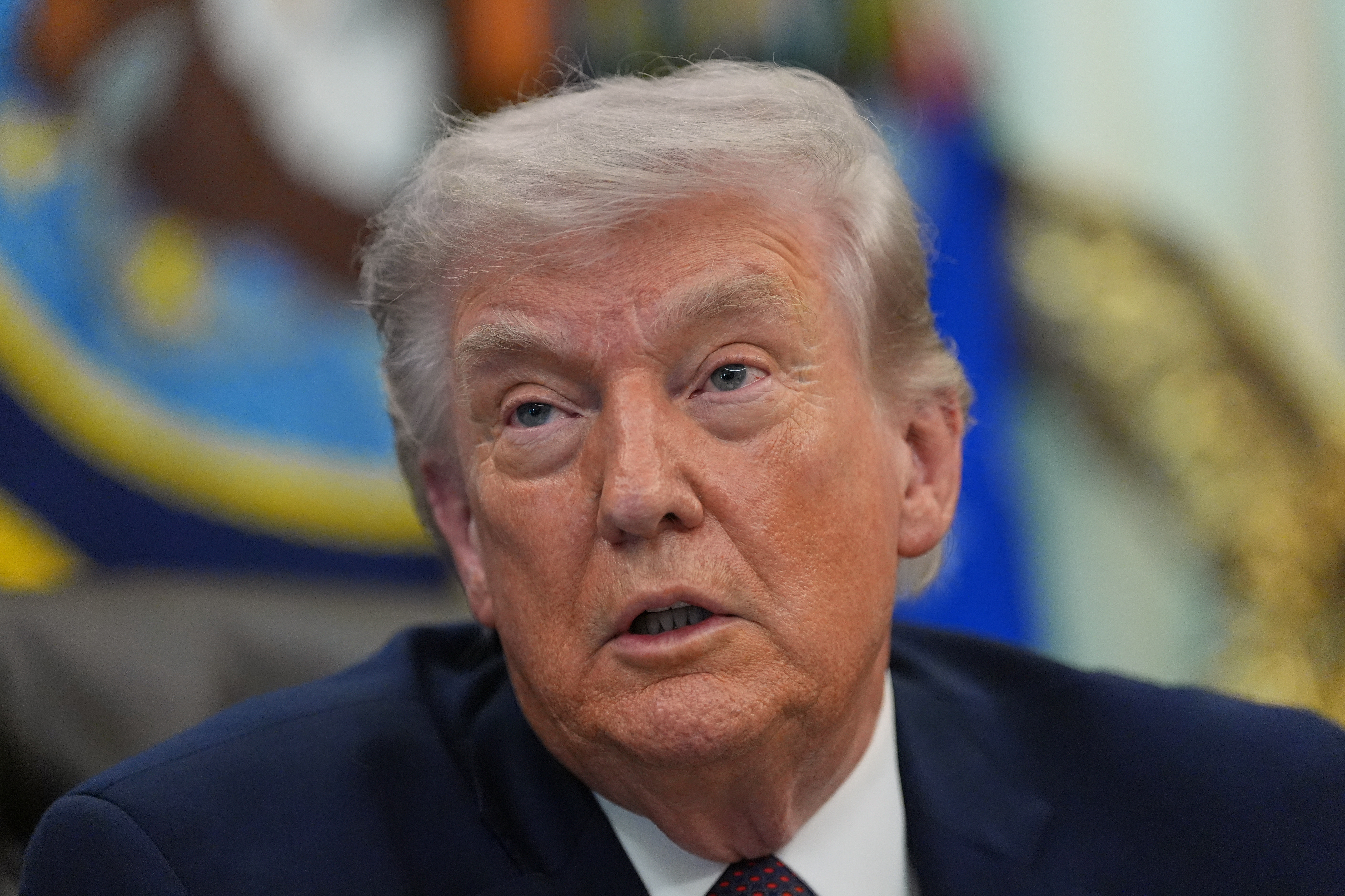 President Donald Trump answers questions from reporters after signing an executive order in the Oval Office of the White House Tuesday, March 31, 2026, in Washington. (AP Photo/Alex Brandon)