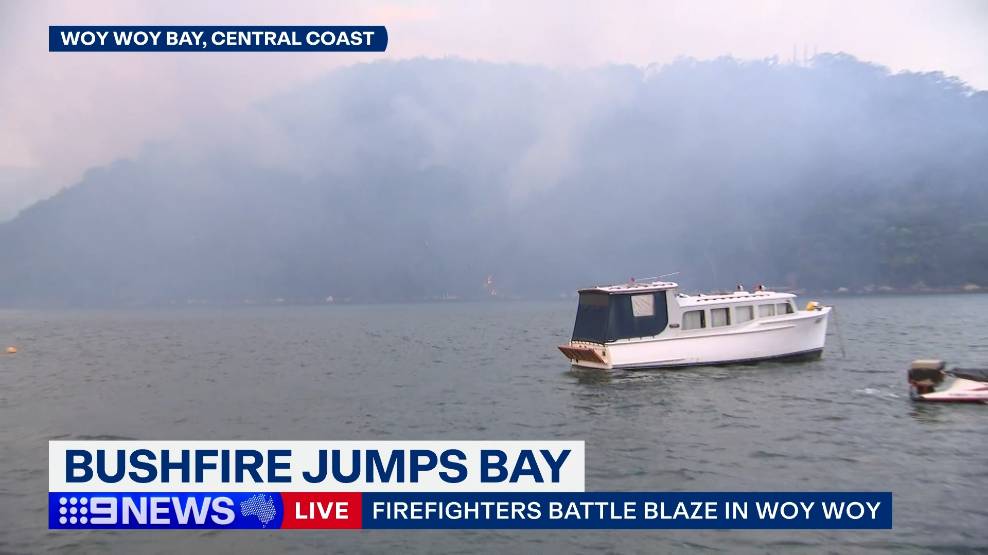 The fire jumped Woy Woy bay late in the afternoon.