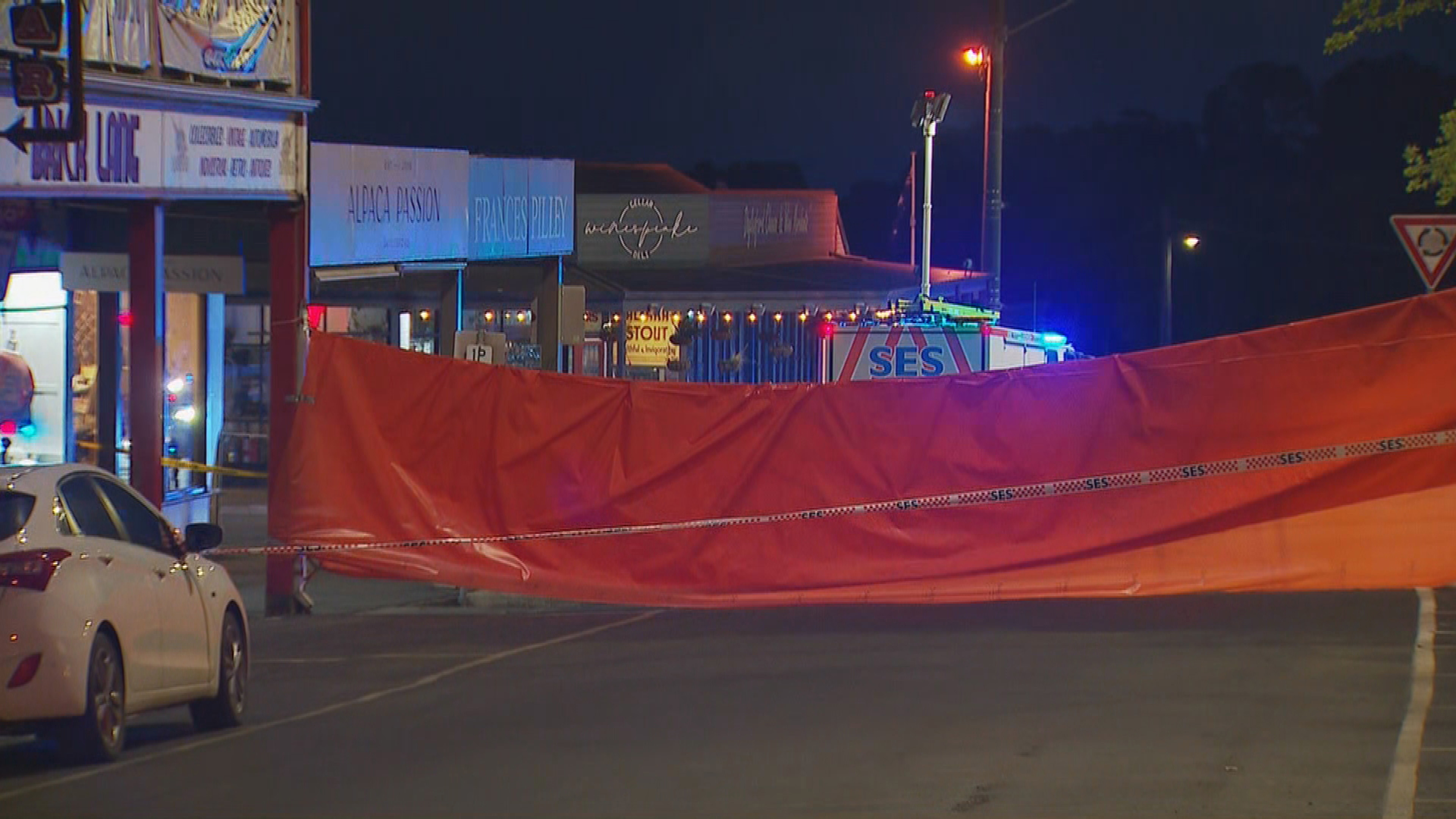 The Daylesford street has now been screen off after three were killed after a car ploughed into a pub garden.