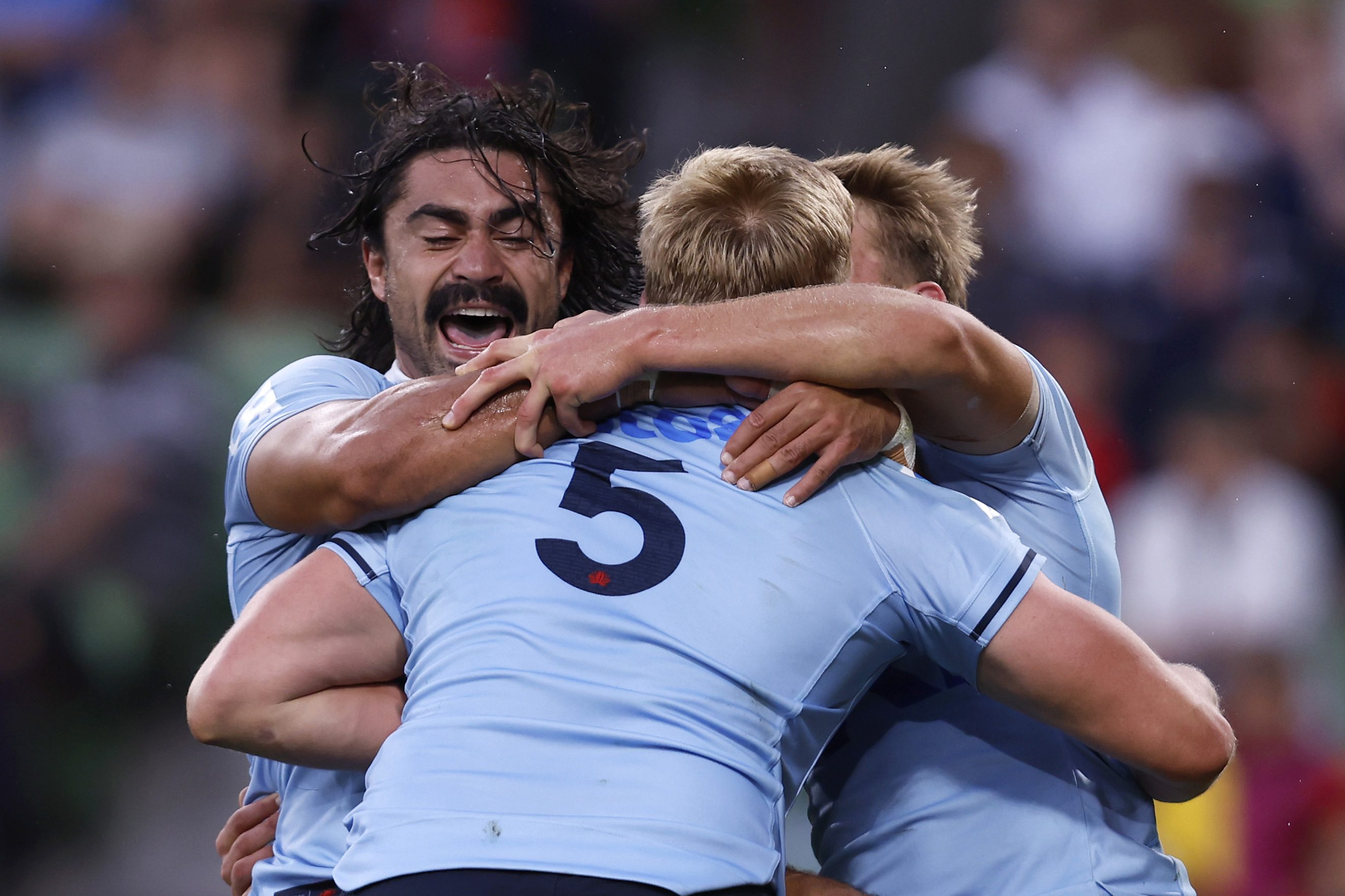 Hugh Sinclair of the Waratahs celebrates a try during the round two Super Rugby Pacific match against the Crusaders.
