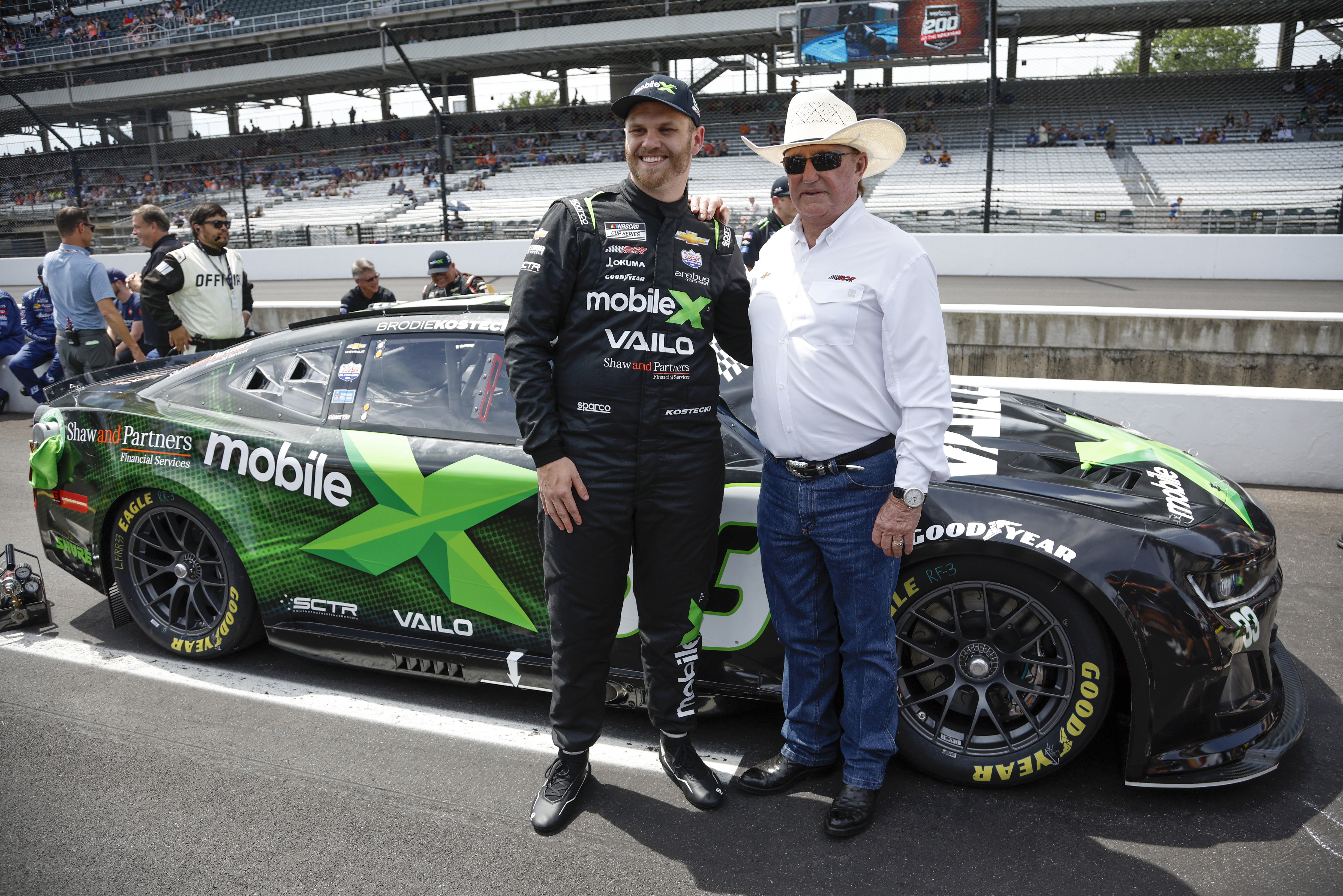 Brodie Kostecki (left) with NASCAR hall-of-famer Richard Childress and the No.33 Mobile X-sponsored Chevrolet Camaro.
