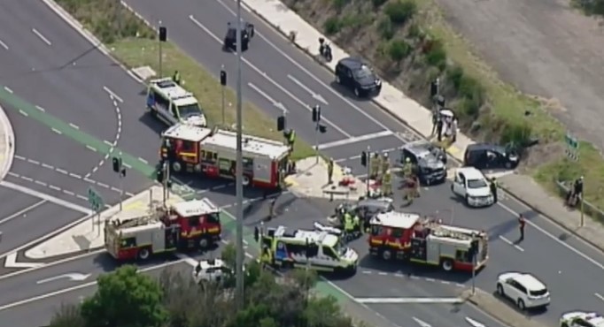 Emergency services swarm the scene of the four-car smash.