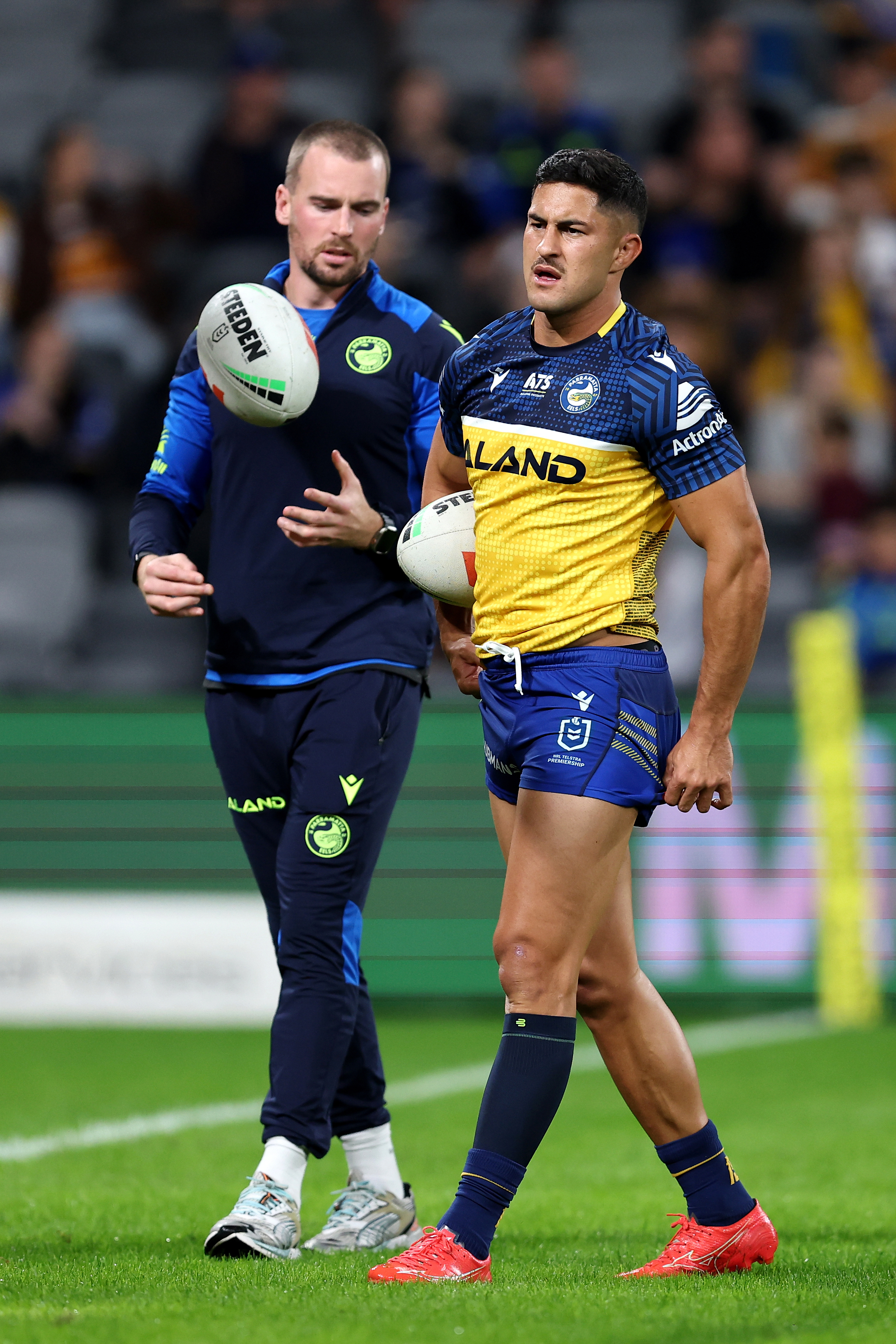 Dylan Brown of the Eels chats to captain Clint Gutherson.