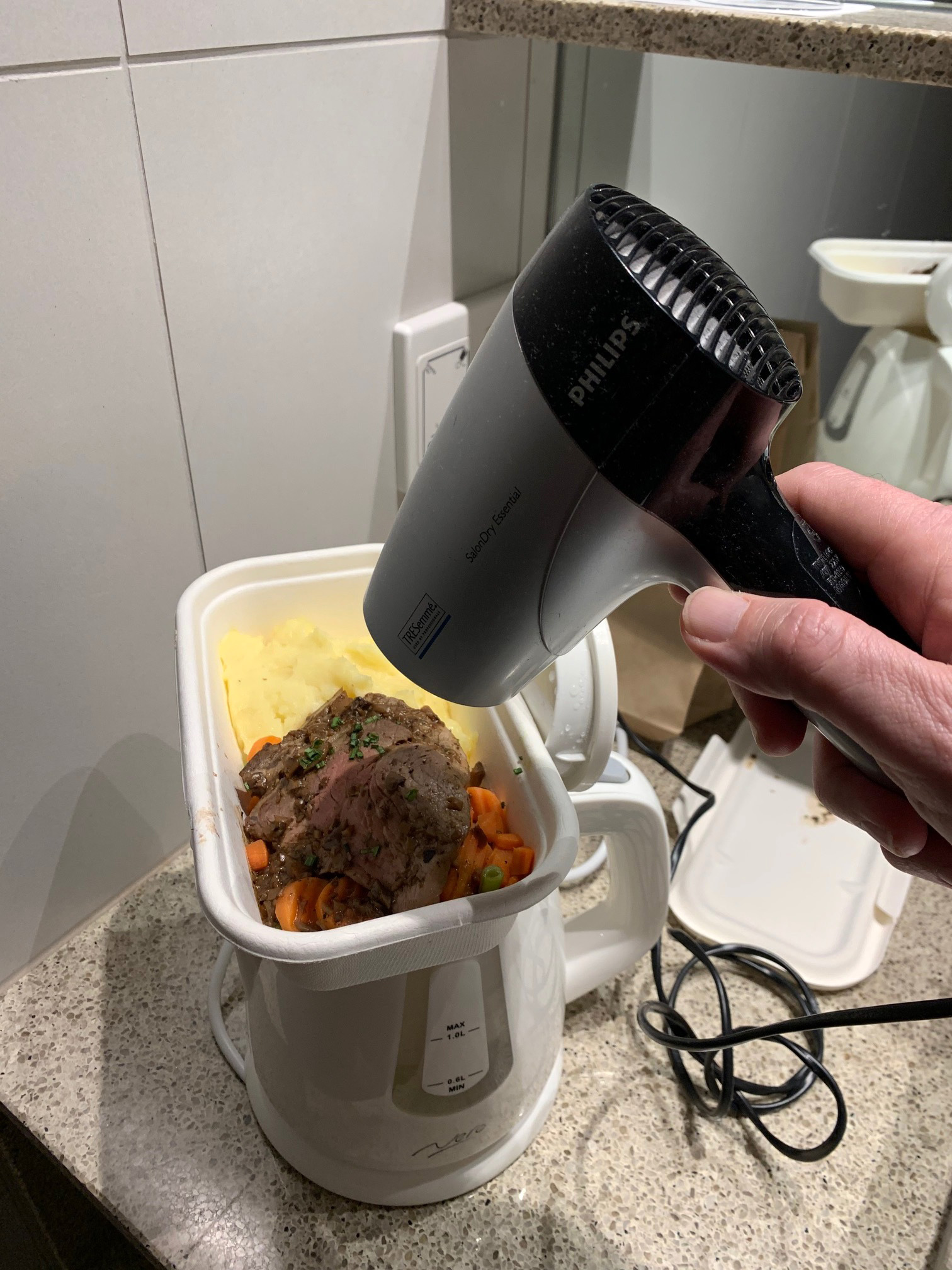 Cameron Croucher has found novel ways to heat up the meals which are delivered to his hotel quarantine room.