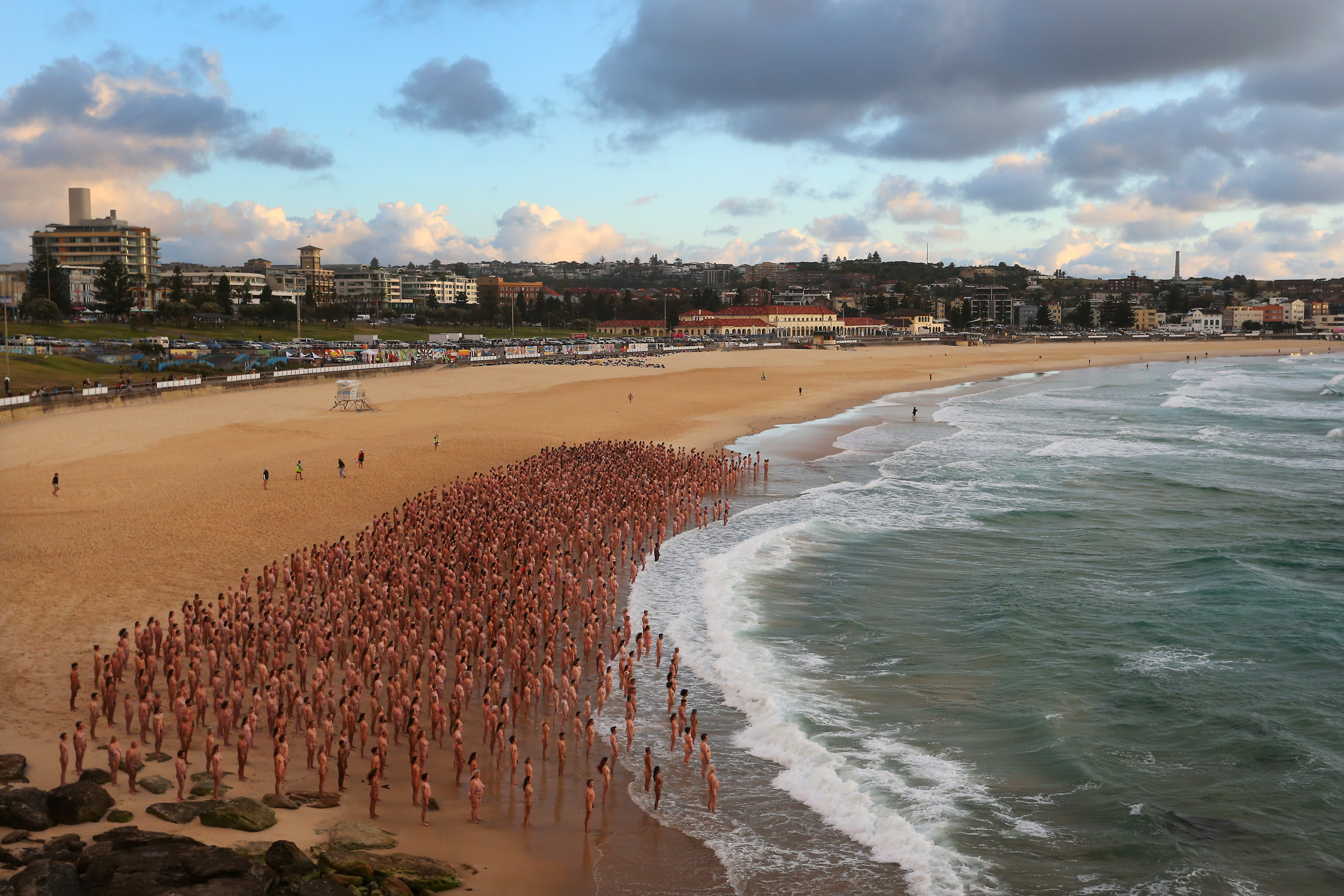 Thousands strip off at Bondi Beach for renowned photographer